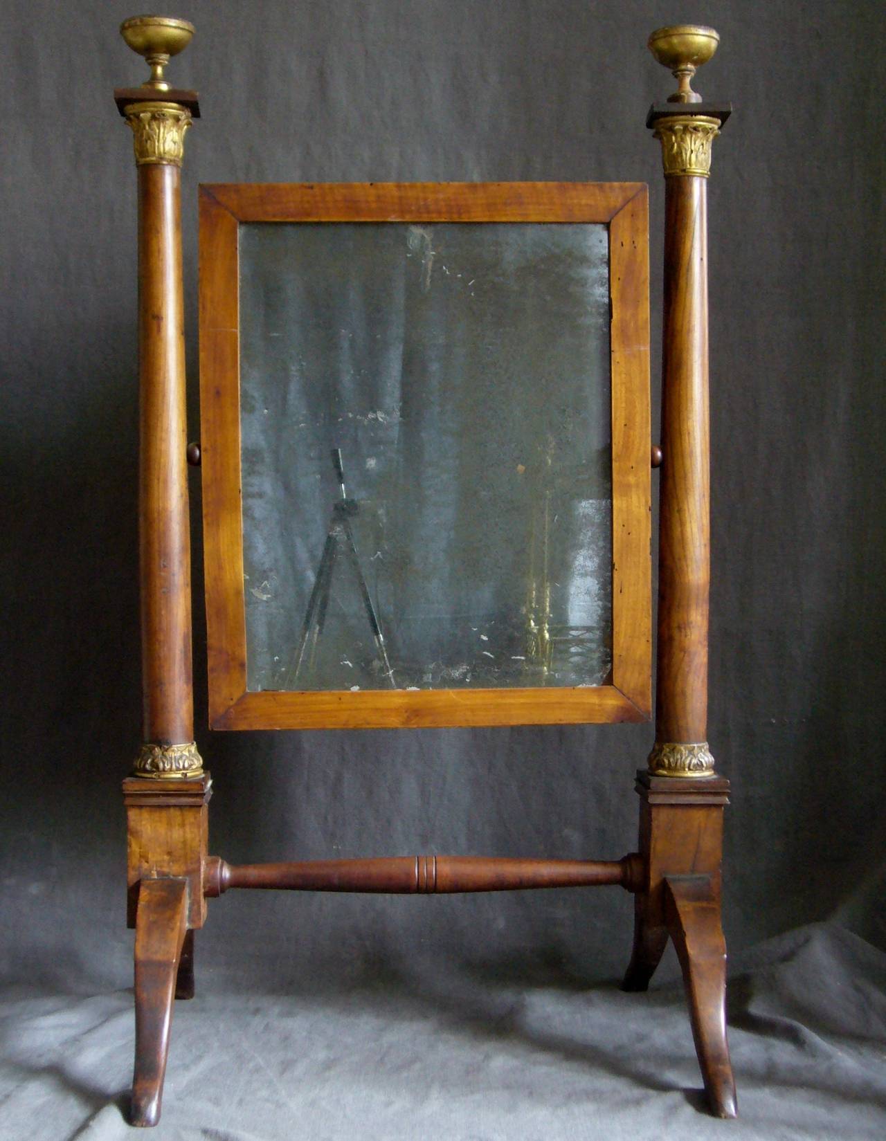 Antique Empire fruitwood dressing mirror with neoclassical giltwood details and original glass. Newly restored, Italy, circa 1800.
Dimension: 21.5
