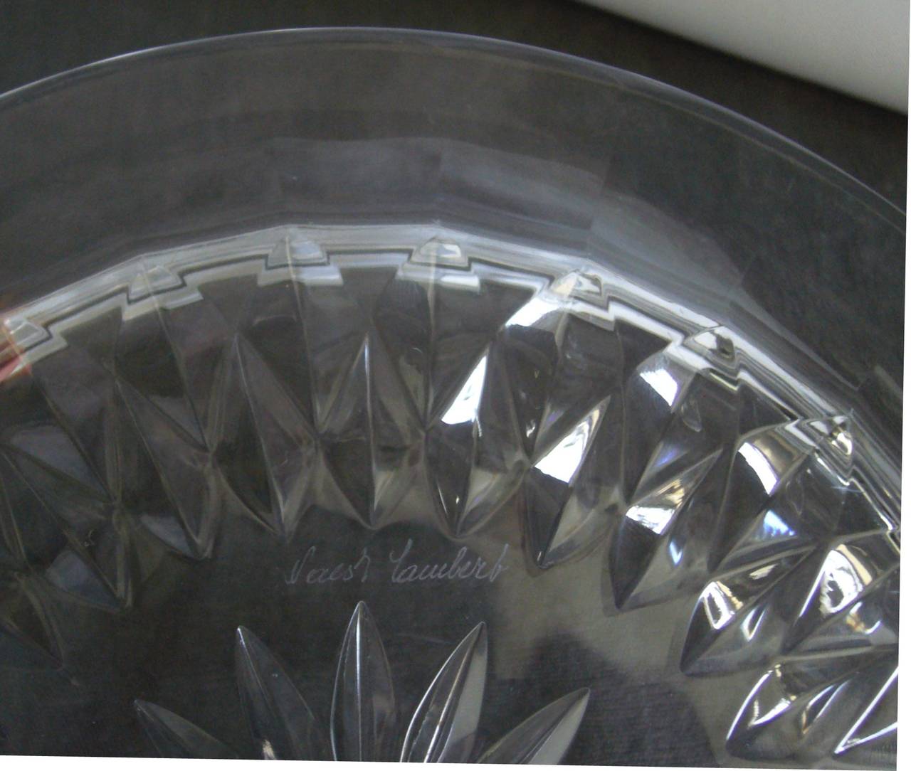 Set of twelve Belgian crystal dessert plates with starburst pattern. Signed 