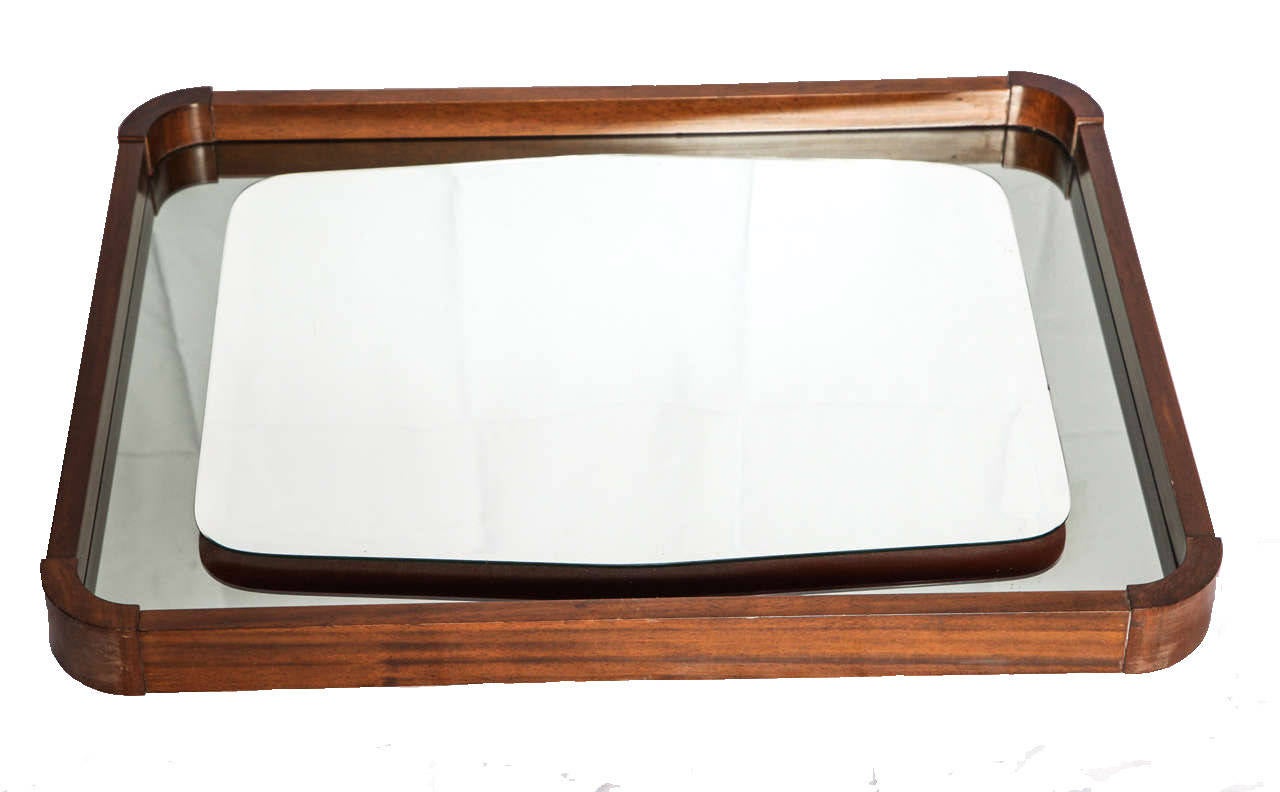Mid-century modern Italian clear mirror floating on grey mirror within walnut frame.
Dimension: 22
