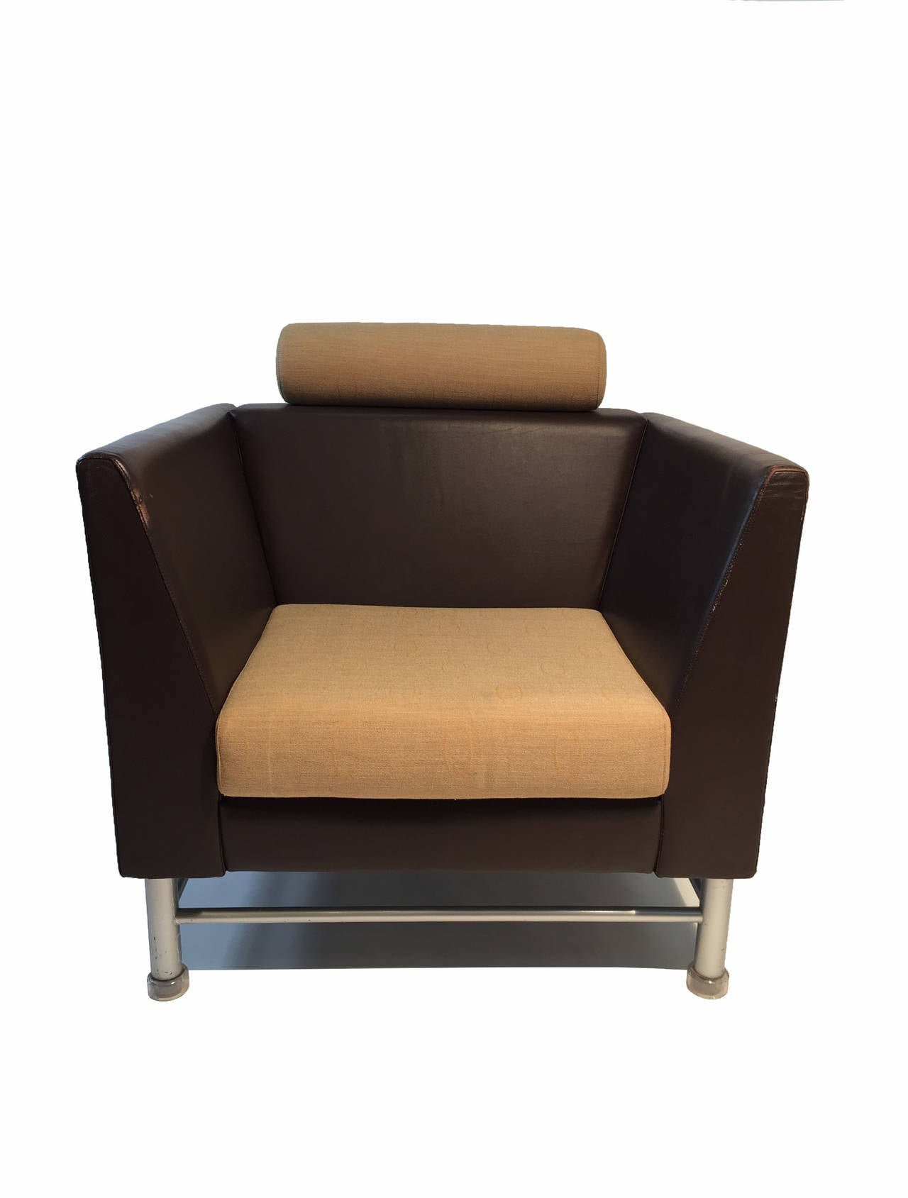 A brown leather and tan fabric lounge chair for Knoll from the prolific Italian architect/designer Ettore Sottsass.