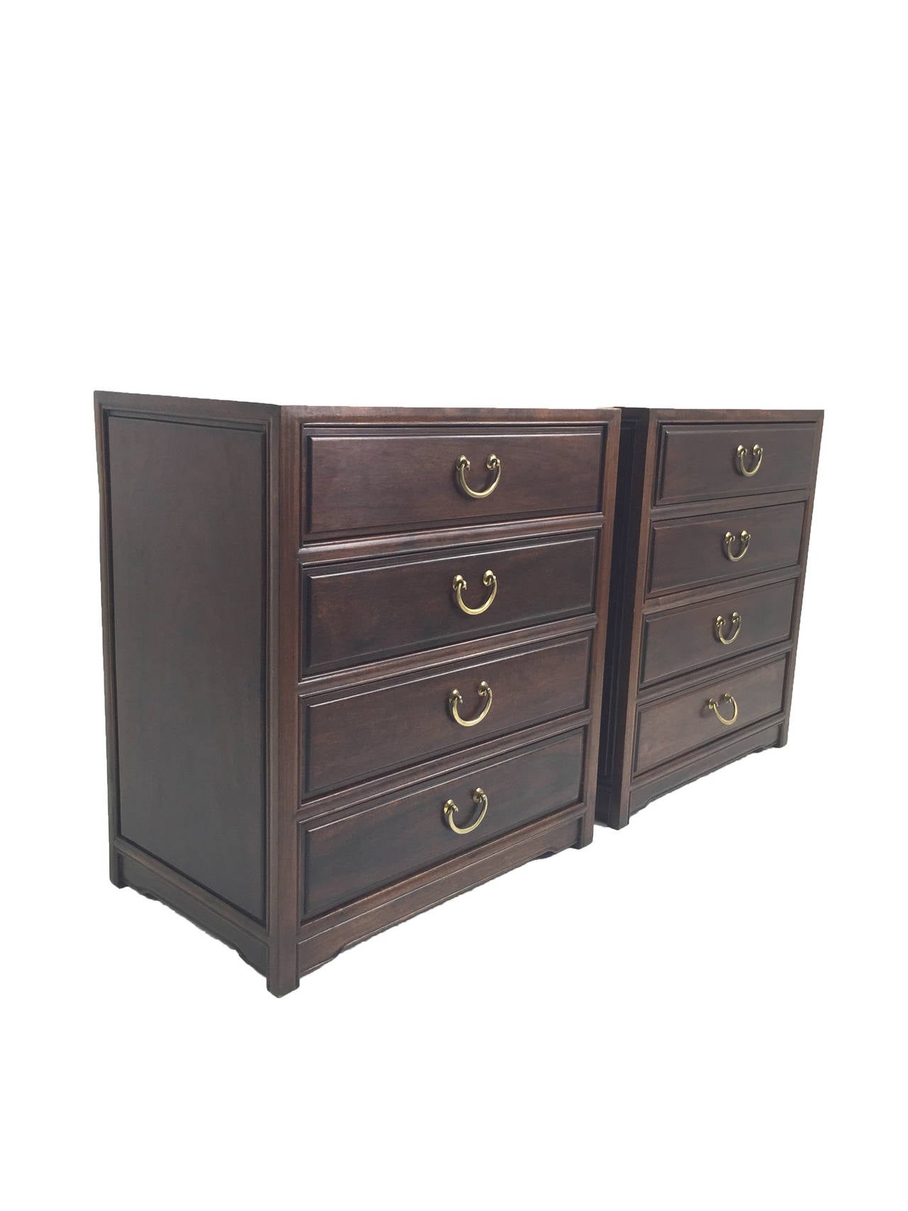 A lovely pair of petite rosewood dressers with brass bail handles.