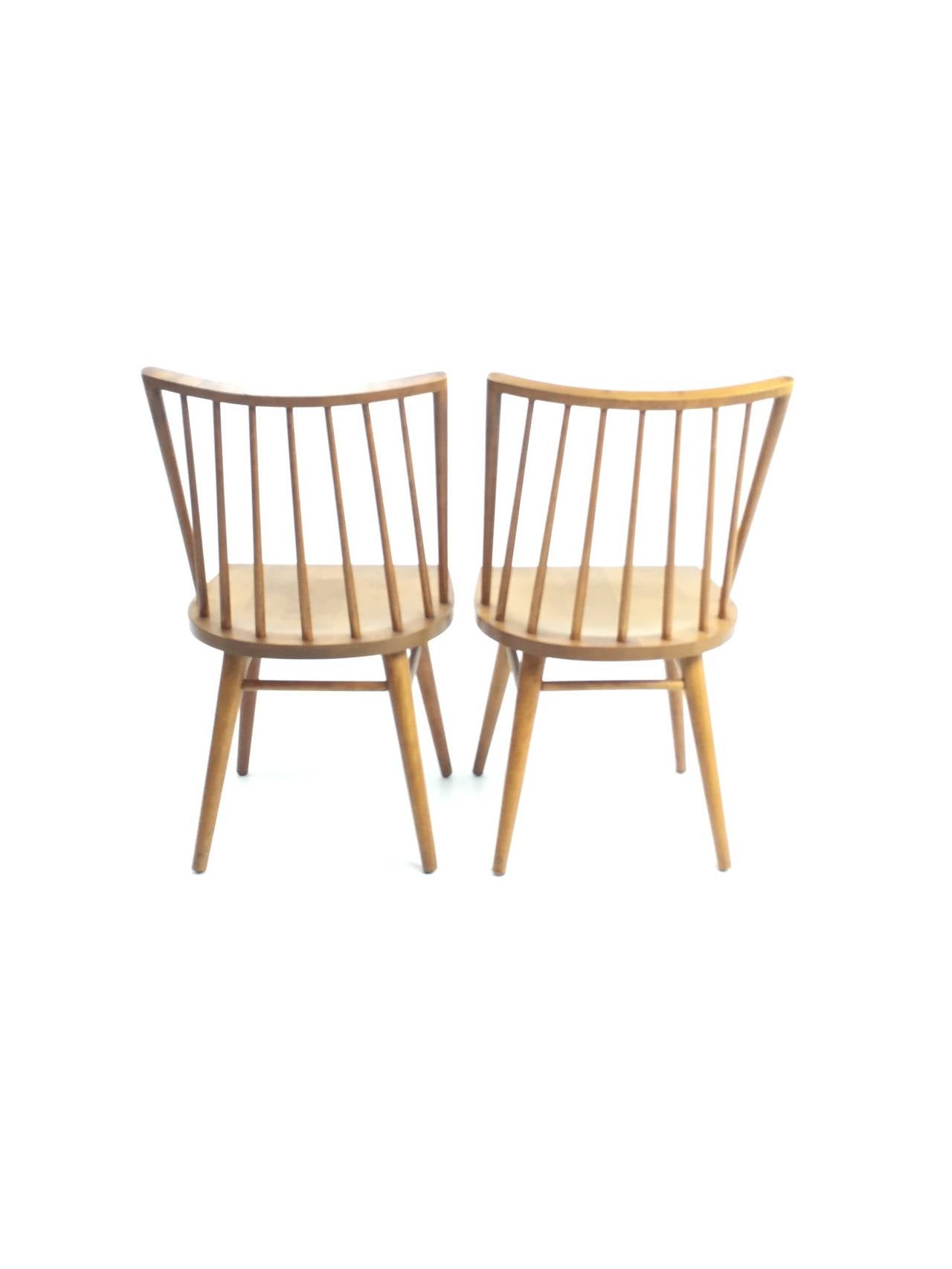 Spindle-back dining chairs of solid birch by Russel Wright for Conant Ball circa 1952.