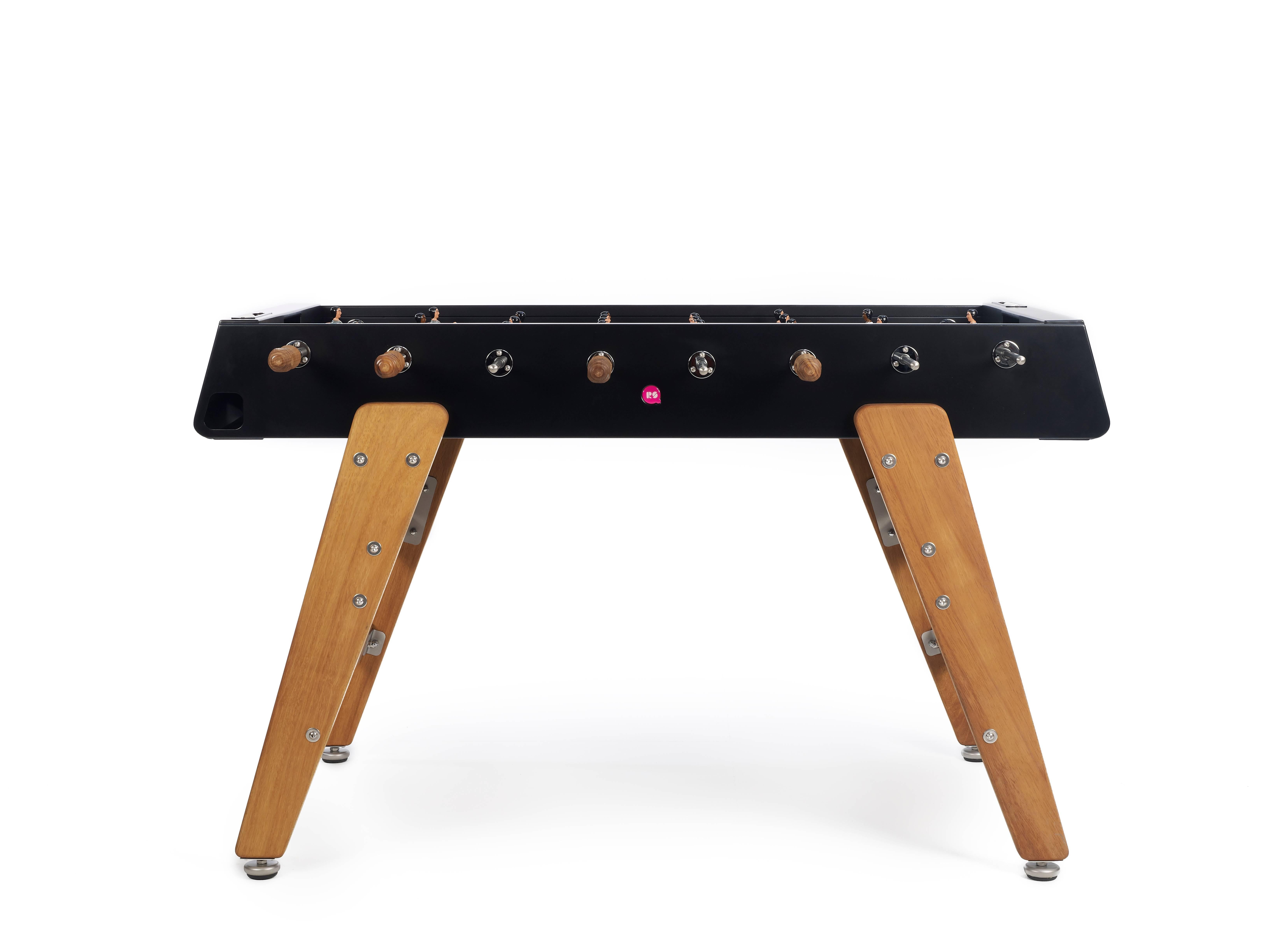 RS3 wood football table pits grey jerseys against white on a black field. Players are based on a vintage Spanish design with splayed legs which allows for better ball control and finesse. The table is made of steel with a cataphoresis process making