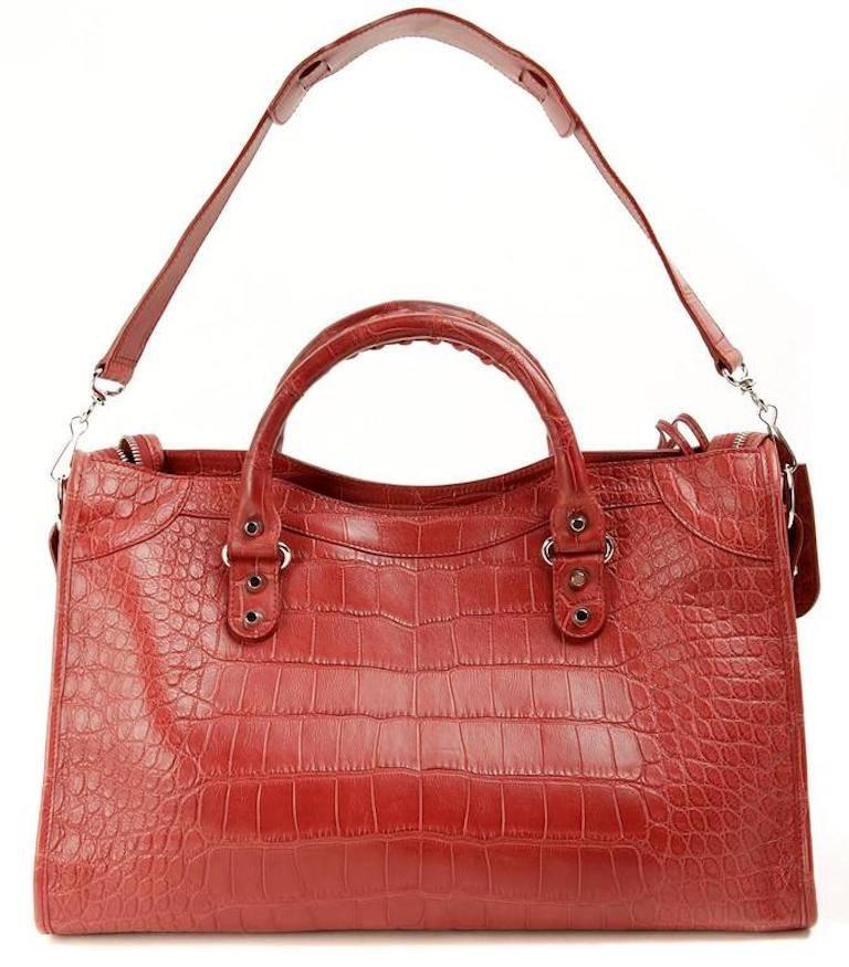 Balenciaga Red Crocodile City Bag- PRISTINE; Appears Never Before Carried Rarely seen in crocodile skin, the classic Balenciaga style maintains all the moto inspired details that have made it an iconic favorite. Matte red crocodile skin satchel is