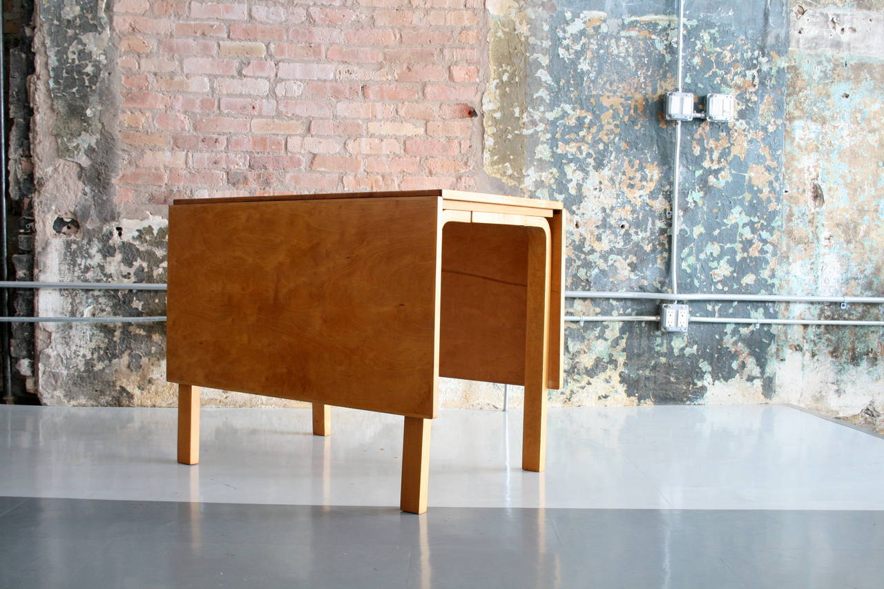 A beautiful early design by Alvar Aalto. Two leaves extend the table additional 19.25 in each direction.