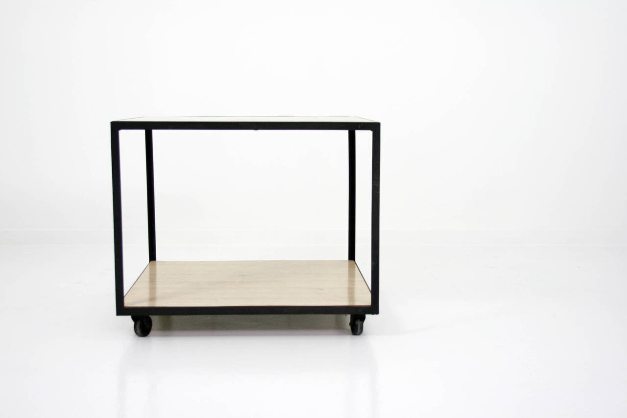 Rolling cart from the Steelframe series, designed by George Nelson and produced by Herman Miller. Black powder coated steel frame with bamboo laminate.