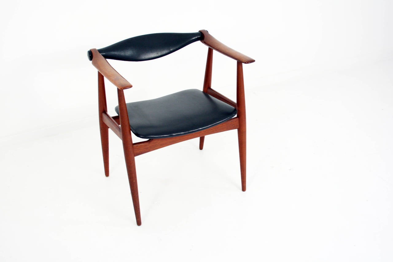 This is a CH-34 lounge chair designed by Hans J. Wegner for Carl Hansen & Son in 1959. This chair was in production from 1959-1964. It has a teak frame and the original black leather upholstery which is in pristine condition.