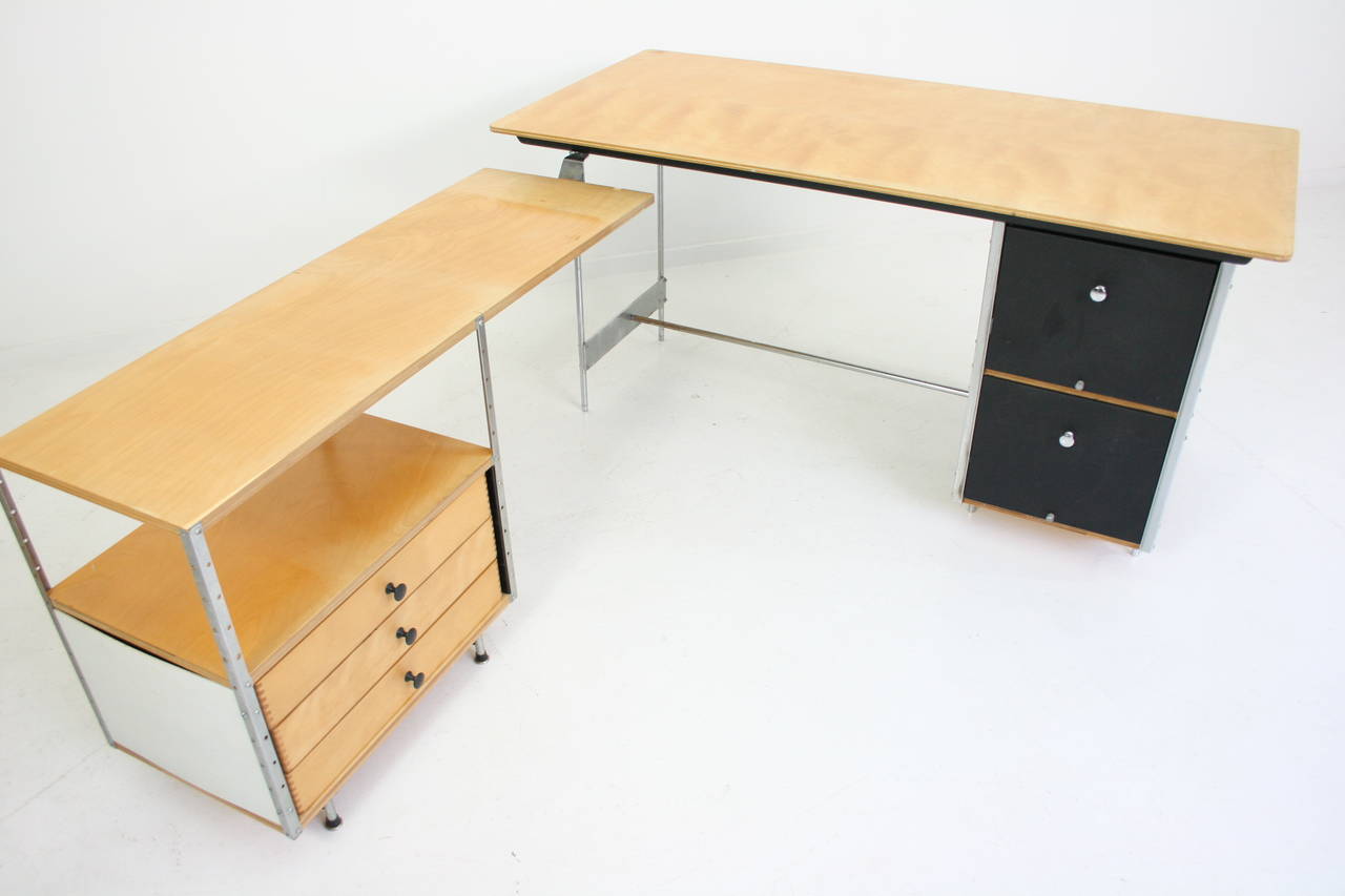 Desk features two file drawers; return features three shallow drawers beneath a single shelf.