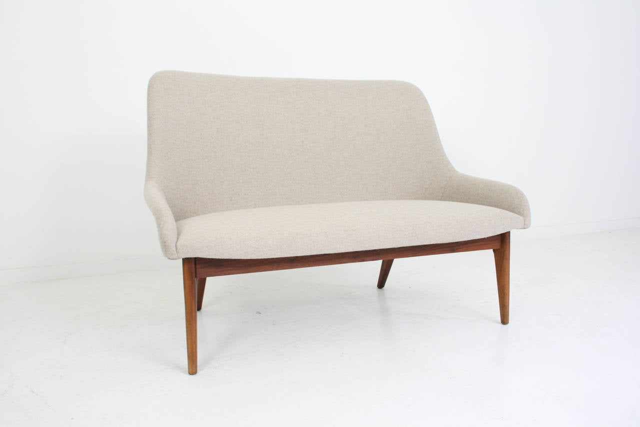 Danish modern sculptural settee in wool maharam fabric on solid walnut frame. circa 1950s.