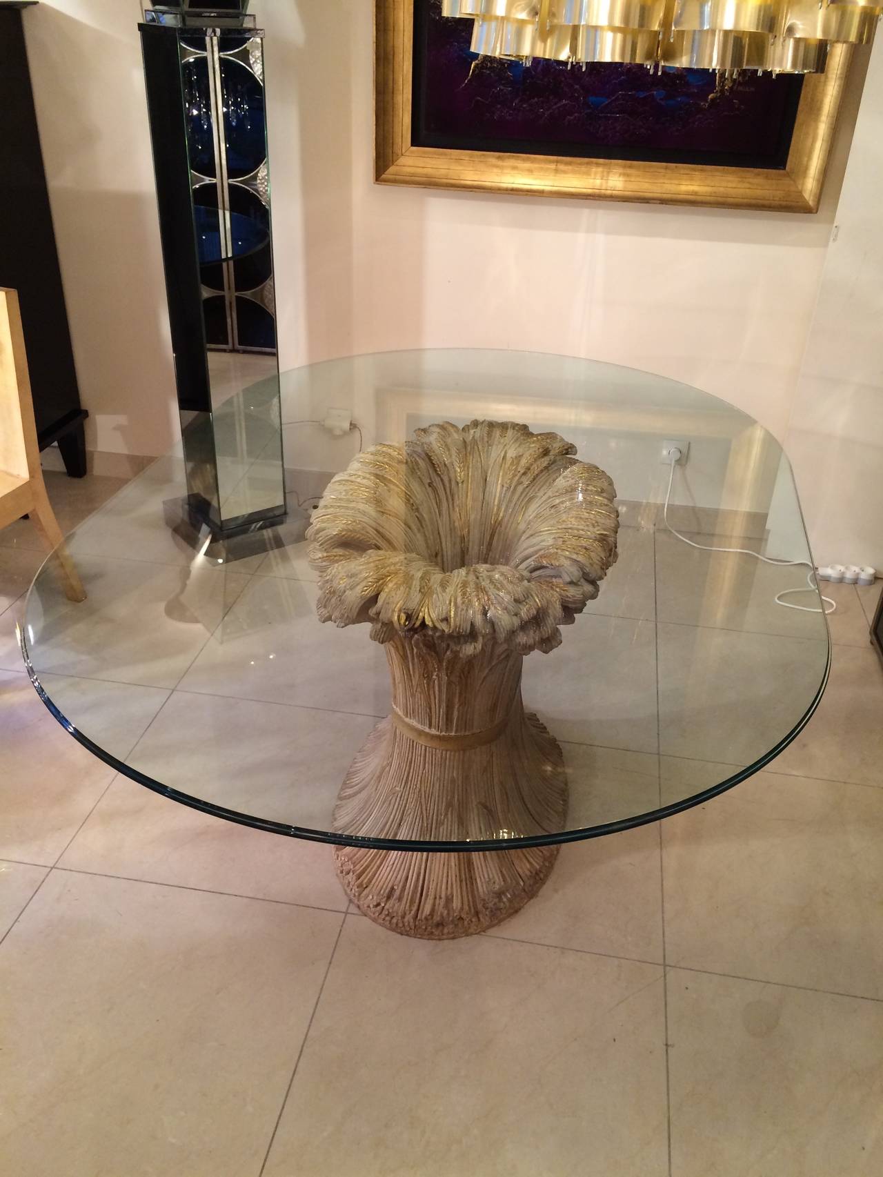 Beautiful dining table by Maison Jansen in sculpted wood,gold and beige patine,ovale glass top.
Arround 1970.