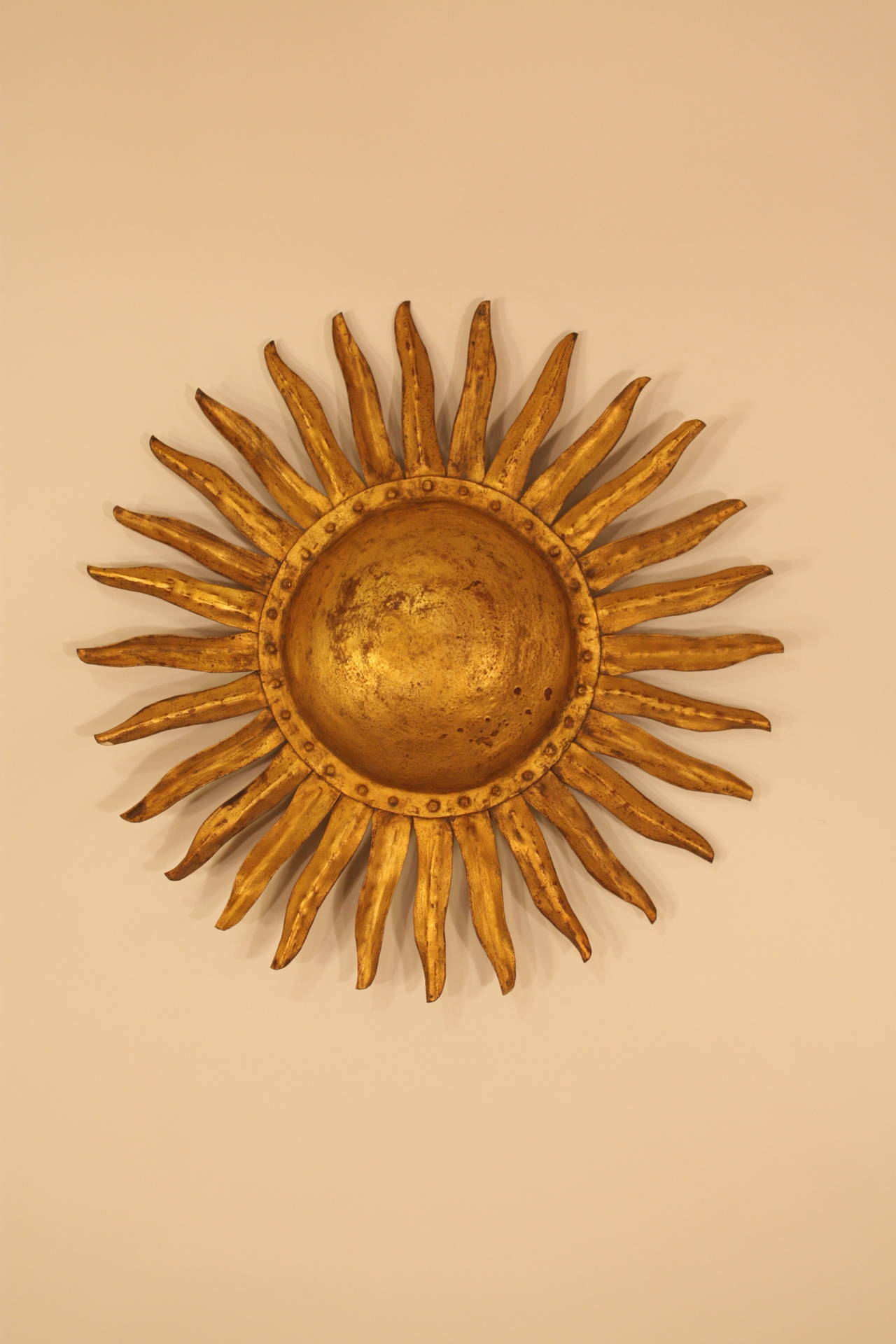 Rare Spanish gilt iron wall decoration sunburst sconce. Original and amazing gilt patina.