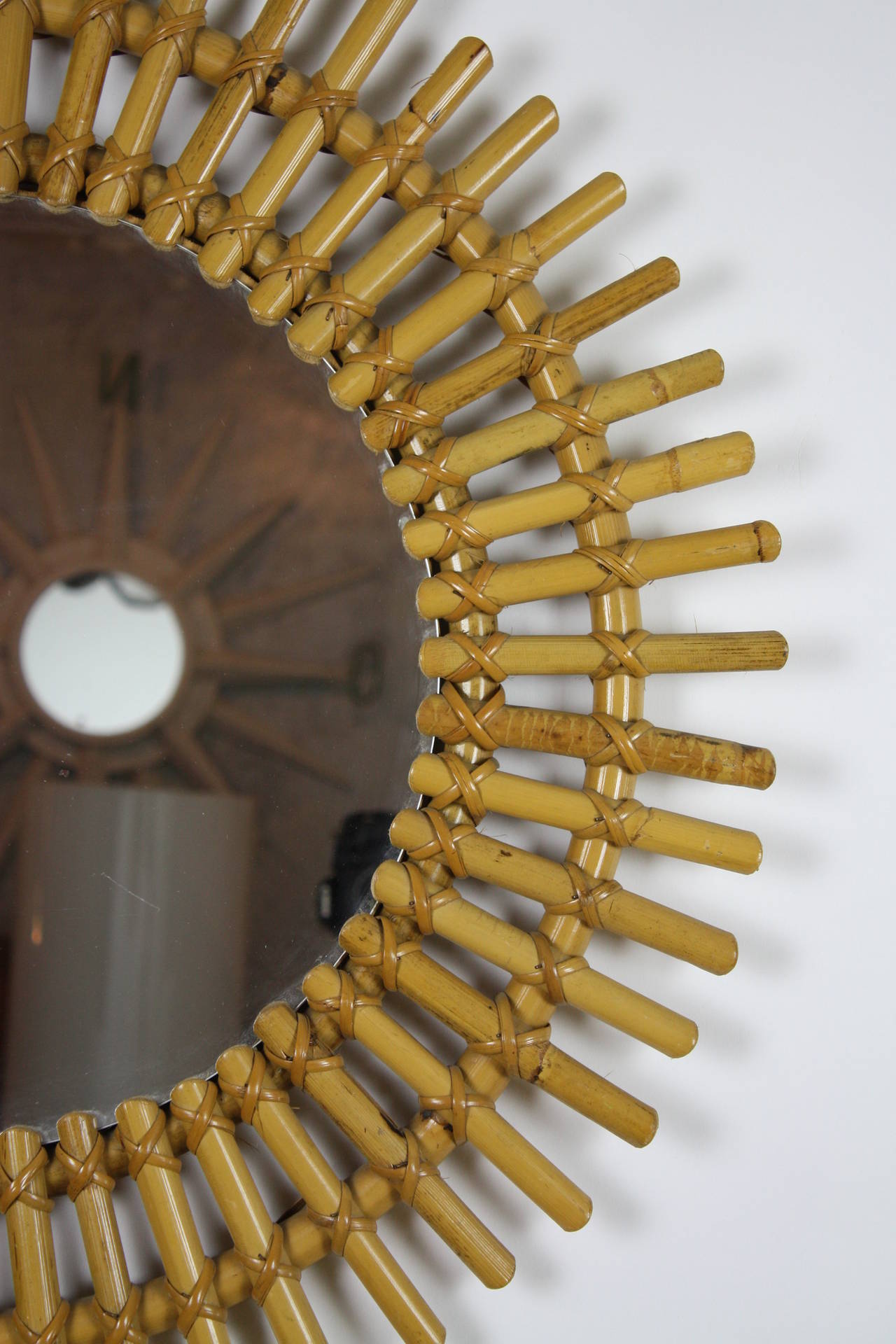 Bamboo cane circular sunburst mirror, original and beautiful patina.