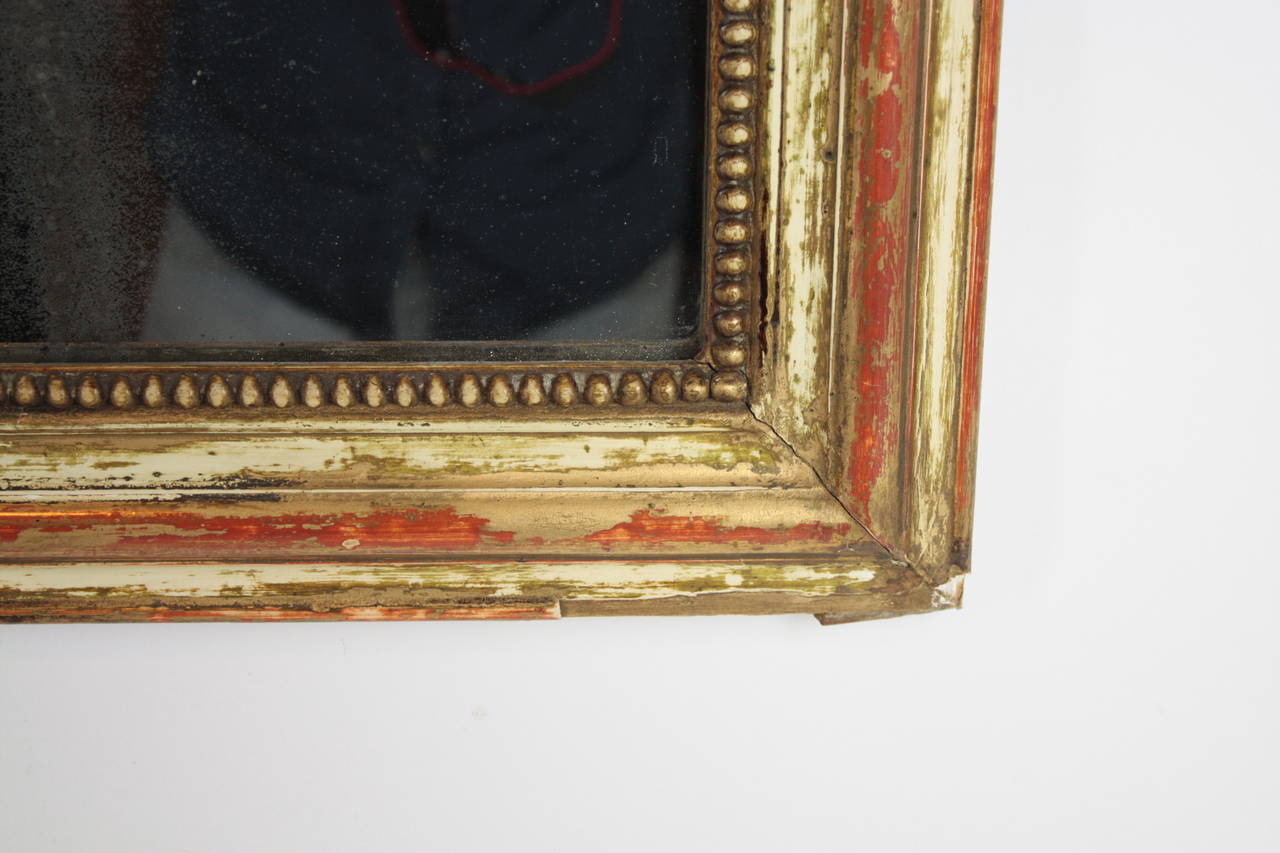 Wood French Louis Philippe mirror with red and beige patina