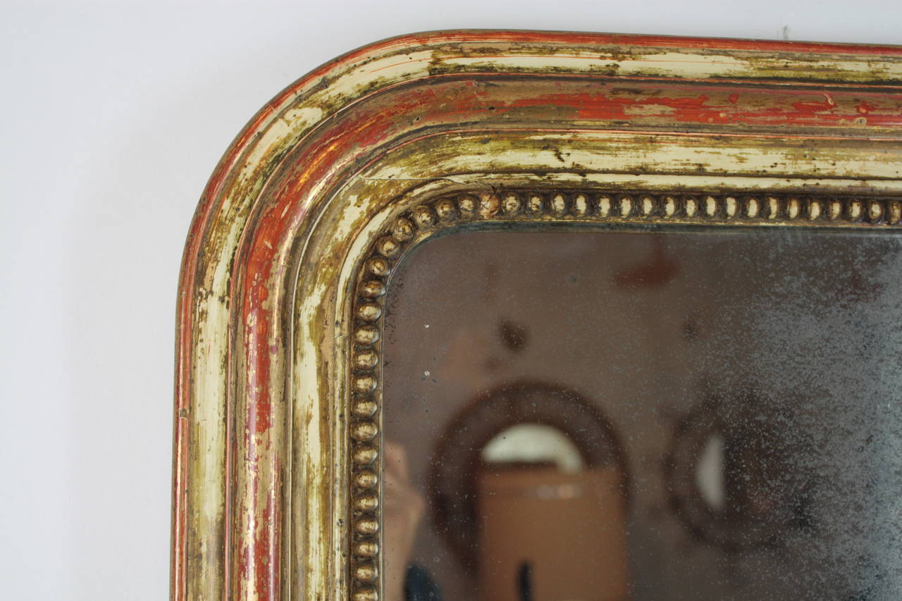 French Louis Philippe mirror with beautiful red and beige patina, original antique glass.