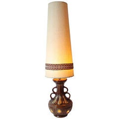 Massive Mid century Fat lava pottery table lamp with original tall shade.
