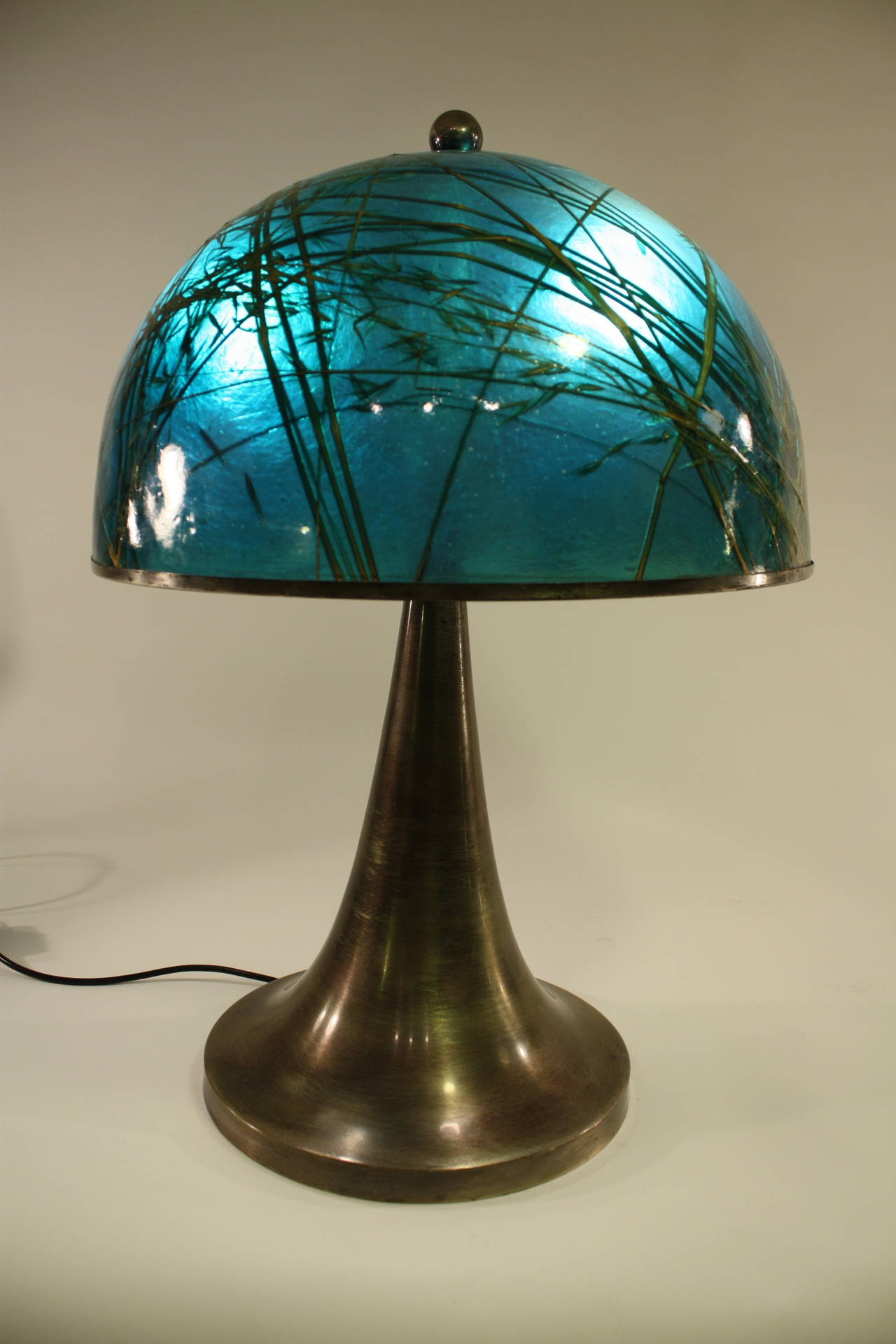 Gorgeous large  lamp with green resin and oats plants inclusions.  Silvered metal base in the style of Gabriela Crespi Fungo lamps.

Spectacular piece finely manufactured. The lampshade has an amazing aqua green/turquoise blue color with 