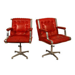 Vintage Swedish 1960's polished cast aluminum and red leather swivel chairs