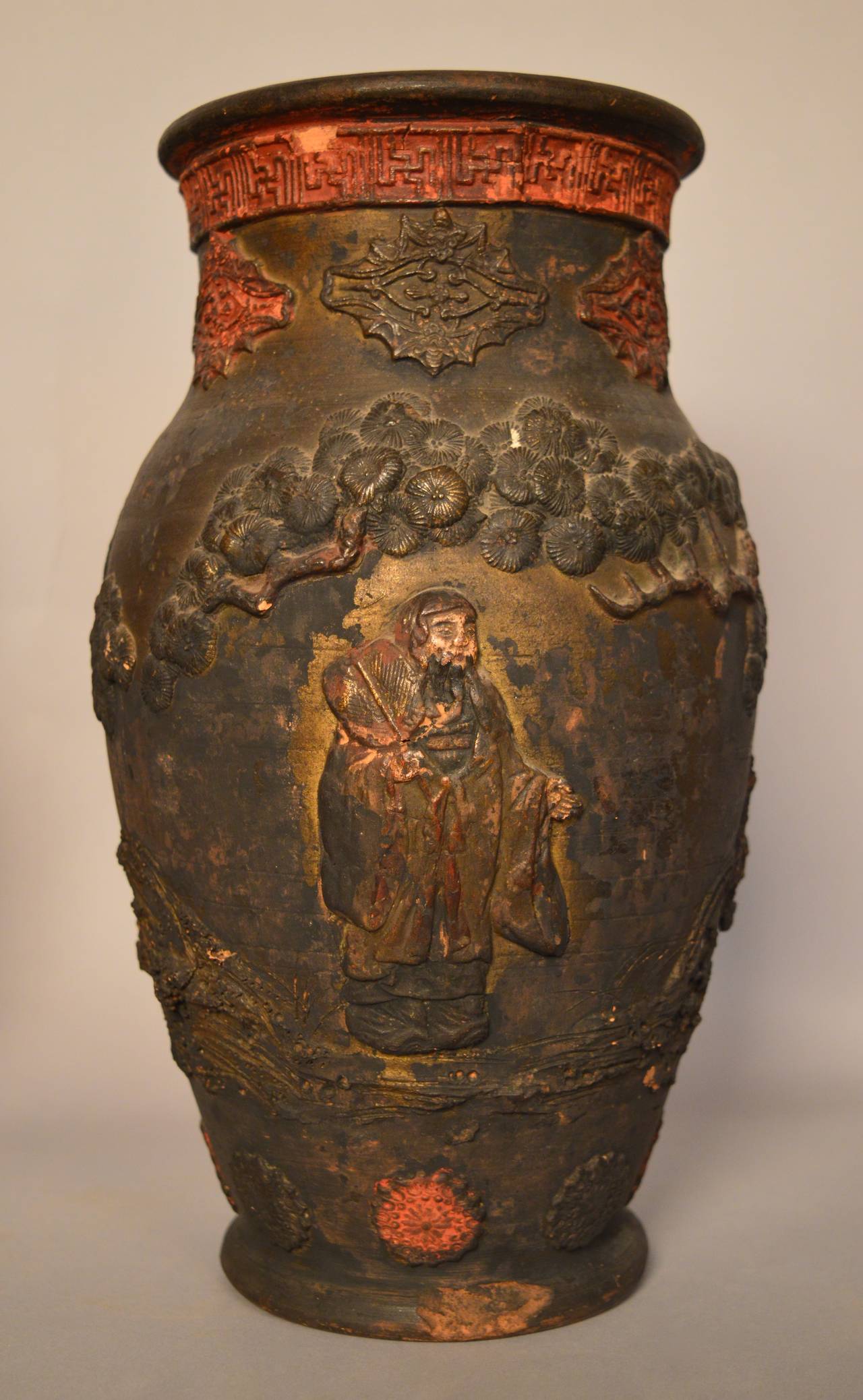 Two Chinese provincial terracotta vessels, circa 1930. Thrown terracotta body with applied terracotta decoration and traces of the original red and gold paint. Vessels such as these would be used to store duck, ginger and dried mushrooms. The top