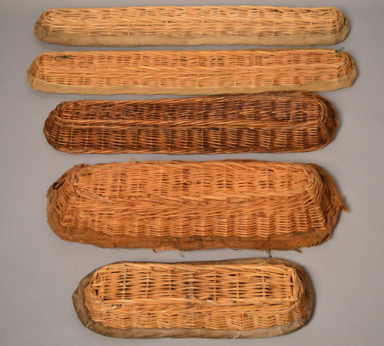 A collection of 5 French bakers baskets circa 1920. Four of the baskets are lined with the original linen. The collection makes a graphic and unusual composition to hang on a wall.
longest=33