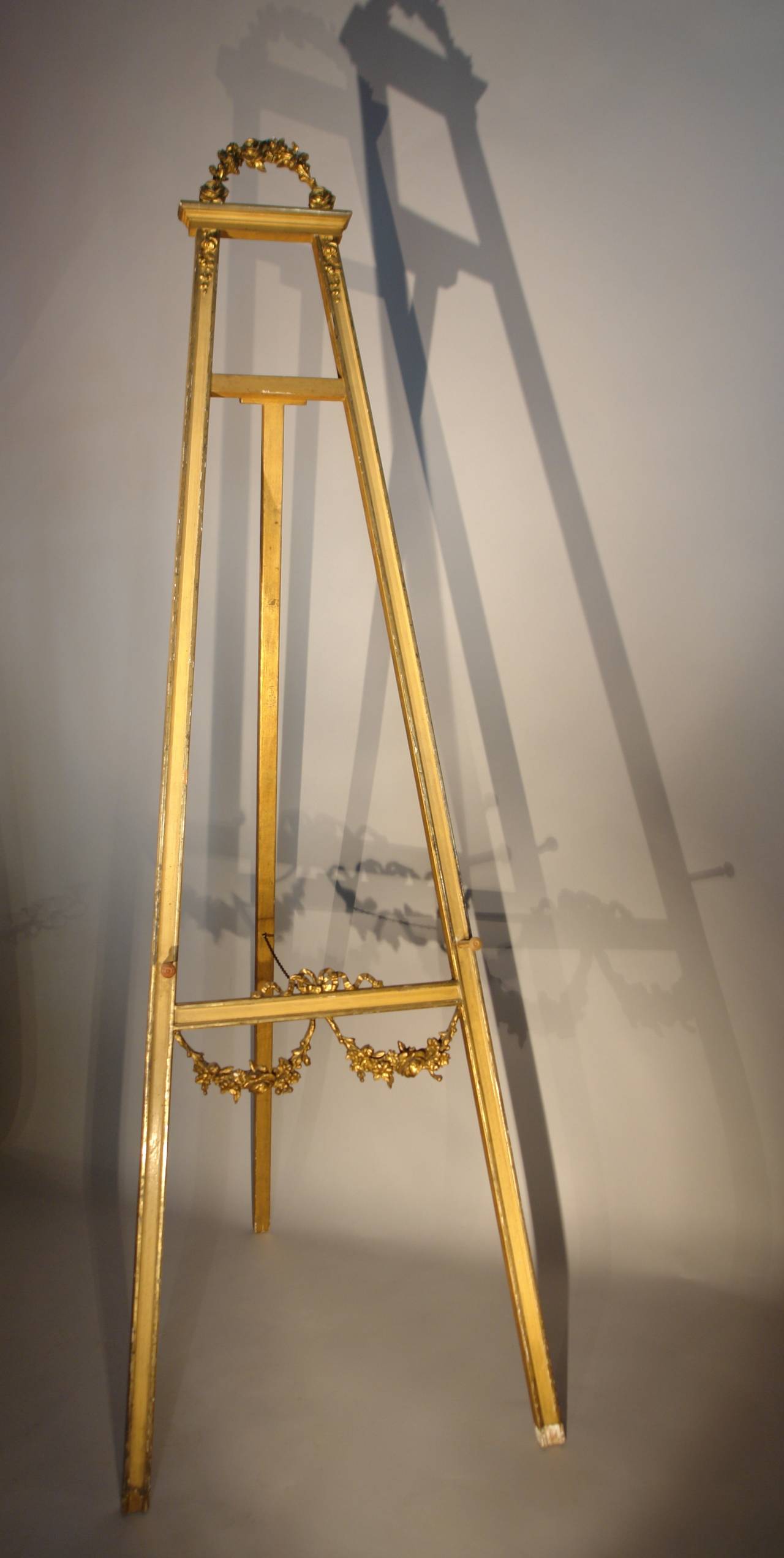 19th century French display easel retaining the original gilding and paint.
Folds flat for transport or storage.