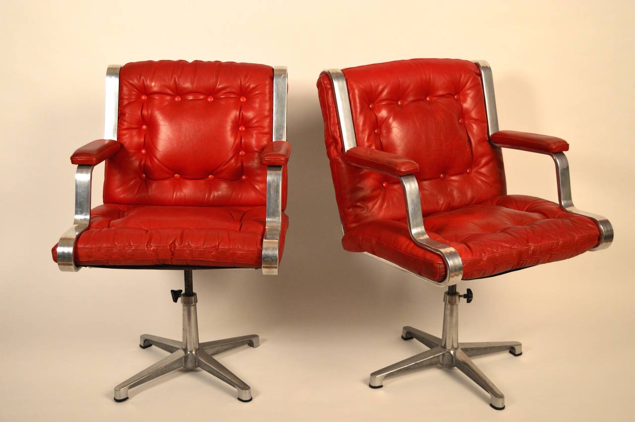 20th Century Vintage Swedish 1960's polished cast aluminum and red leather swivel chairs