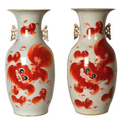 Two 19th c Chinese porcelain Qing vases decorated with orange foo dogs