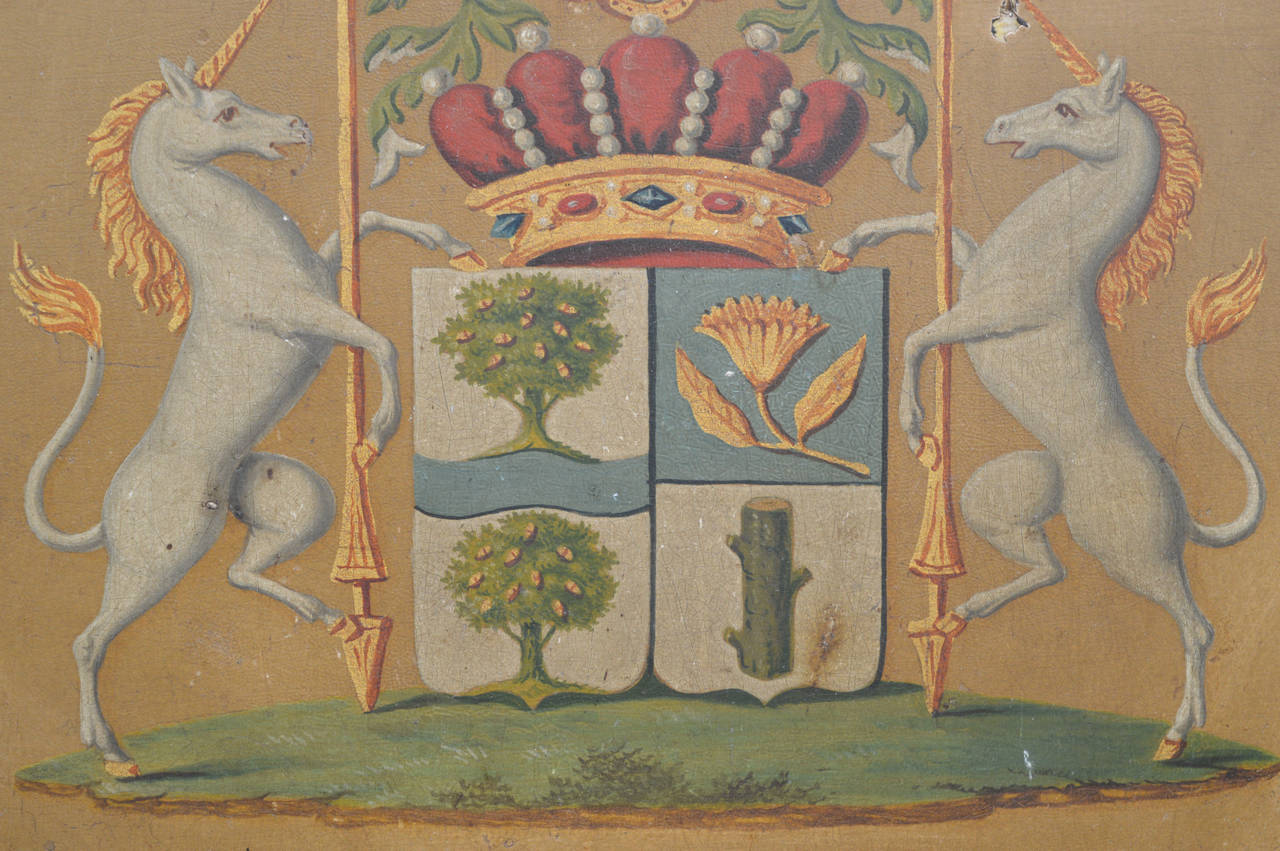 An exceptional 18th century painted wood armorial plaque from the city of Liége in Belgium. Original linen backing and hand planed wood brace.
