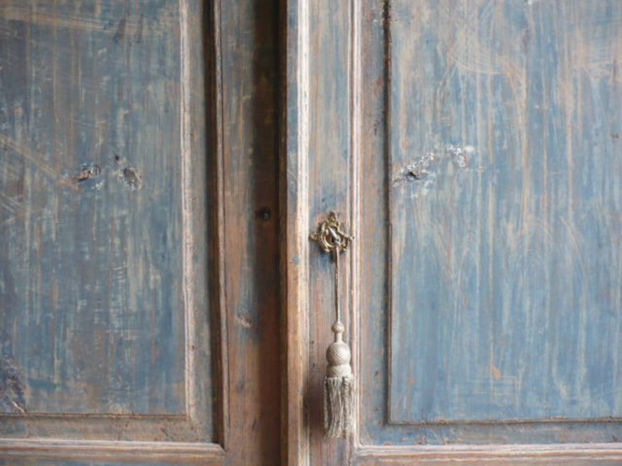 Early 19th century Northern Swedish secretary bookcase with the owners initials and the date of 1823 painted on the doors. 
The pure and robust lines of the secretary echo the coastline of the north.

Hand scraped to reveal the original sky blue