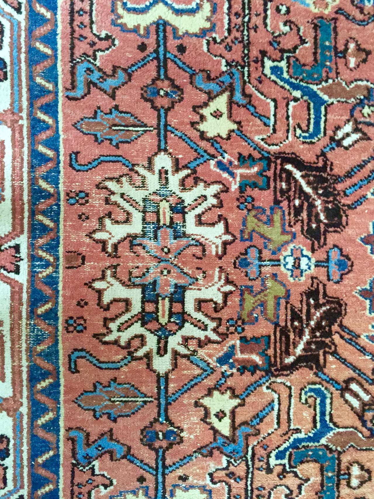 This hand knotted Persian carpet dates to the mid 1920-1930s and was made in colors that would appeal to the European market. It was quite popular among the high classes in Sweden, Portugal and Germany to commission Persian carpets in colors to suit