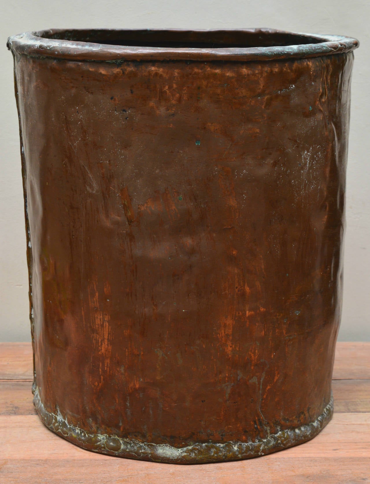 This is a solid copper bin circa 1880. The naturally acquired patina could not be more beautiful.
The size of this bin makes it possible to use for logs, as a planter, or as a waste paper bin.