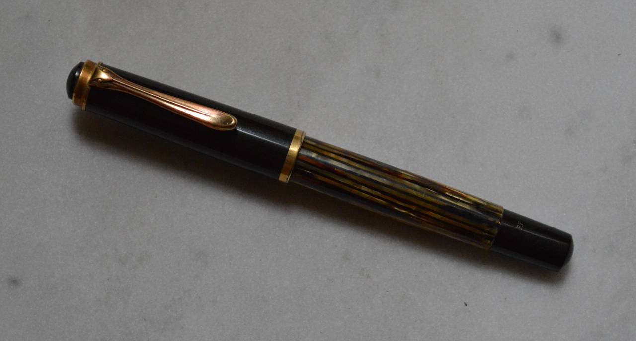 Gunther Wagner edition tortoise celluloid fountain pen made by Pelikan between 1950-1956.The shaft is marked; Gunther Wagner and the original gold nib is marked; Pelikan14-karat 585.