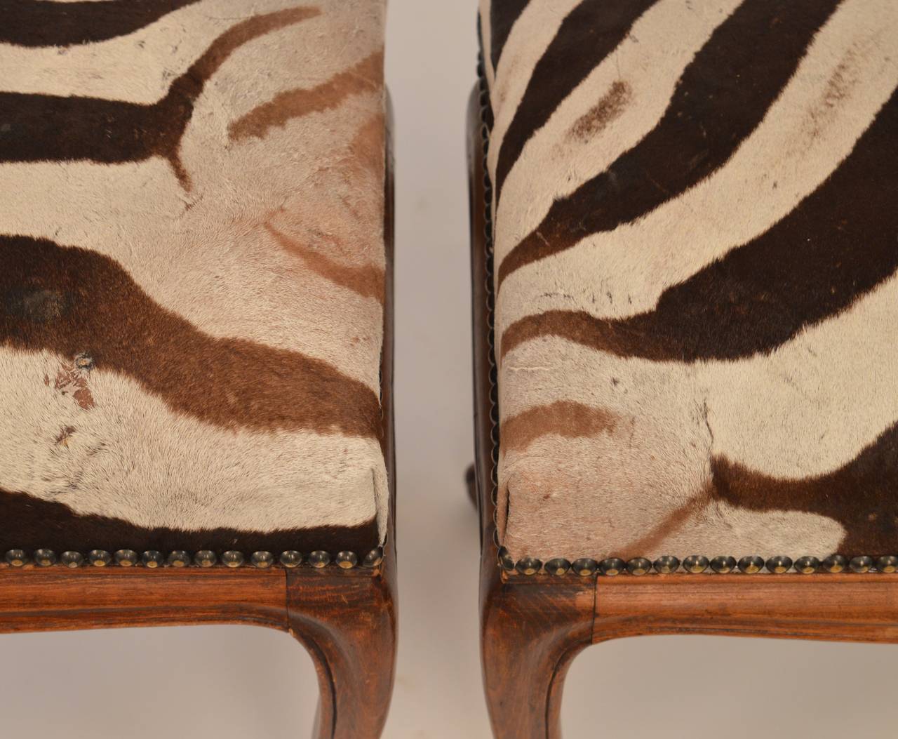 Oak A pair of French Louis XV style benches with zebra upholstery