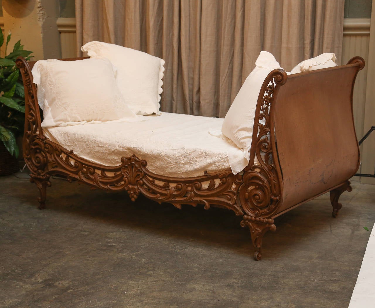 Faux painted sides daybed with cast ornamentation and front rail.

Suitable for many rooms in home, as well as on veranda.

The mattress and boxspring are new and have never been used. 

On casters