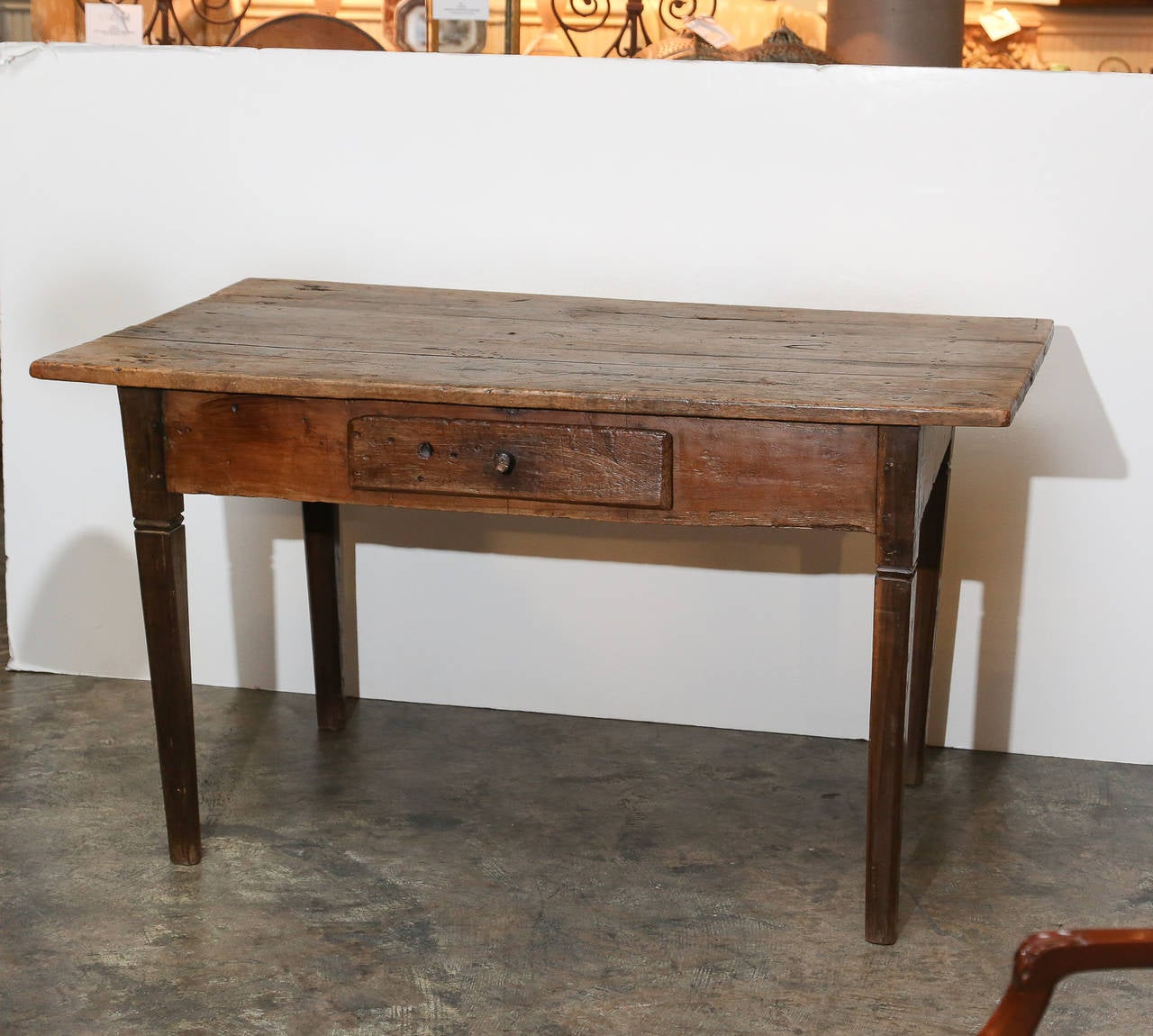 Very simple oak worktable with nice patina and work marks on 4 tapered
 legs

Single drawer with wooden knob in 6