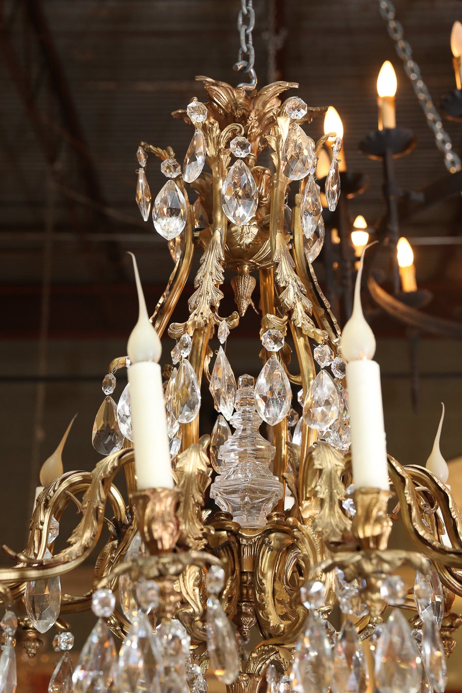 Beautifully detailed chandelier with acanthus leaf arms. Each bobeche has a acanthus leaf holder and finial. Faceted crystal ball at bottom.