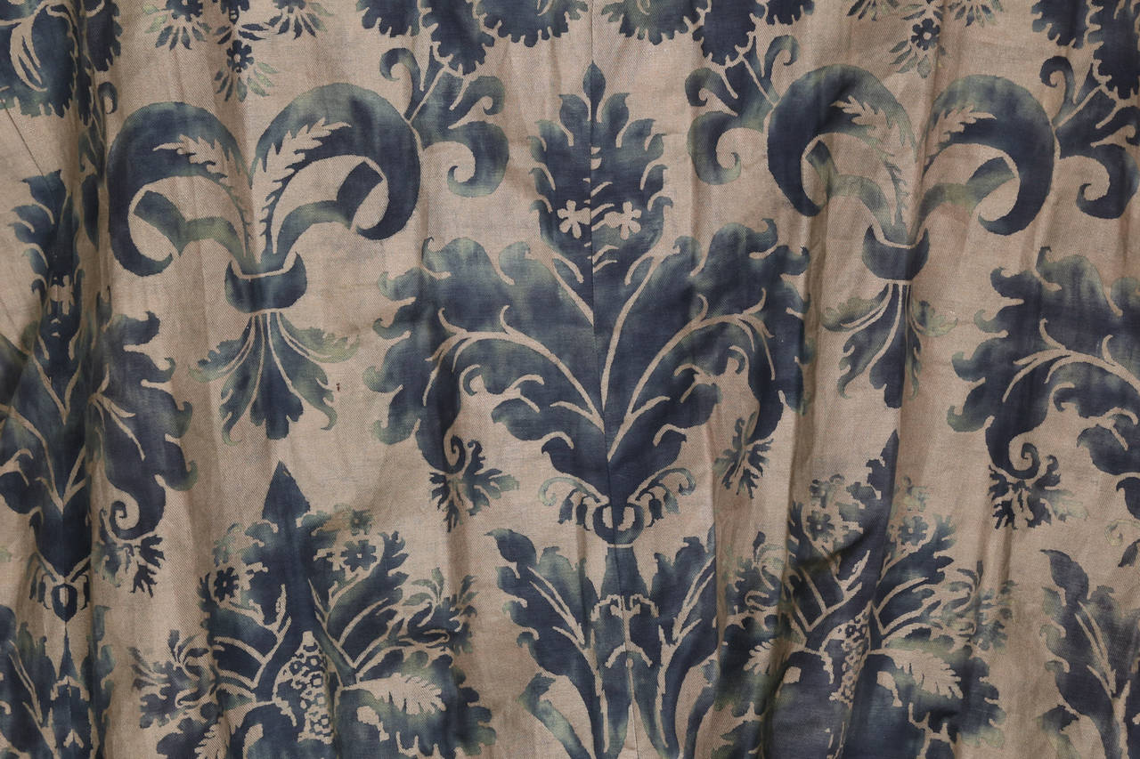 Four pleated panels of navy blue Fortuny pattern printed on linen.