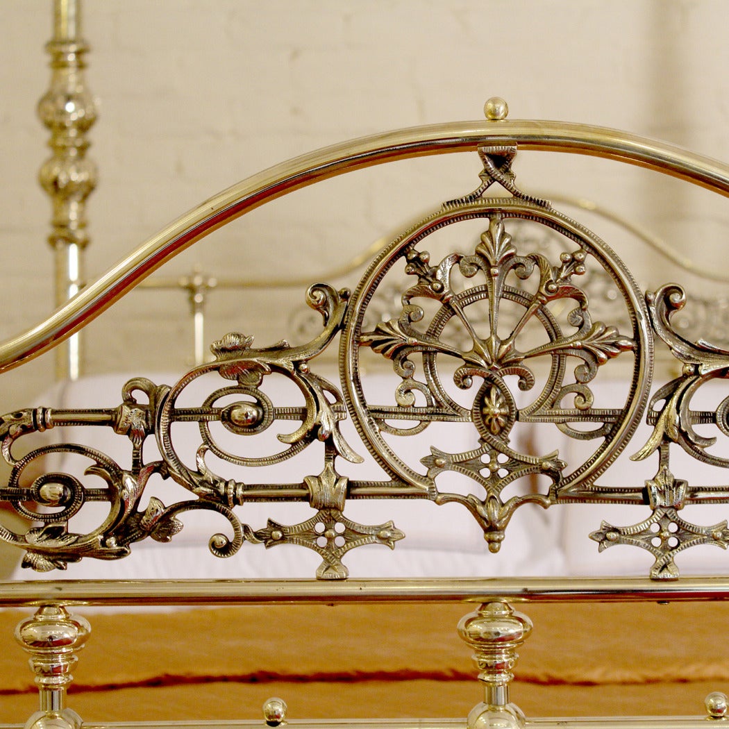 brass four poster bed