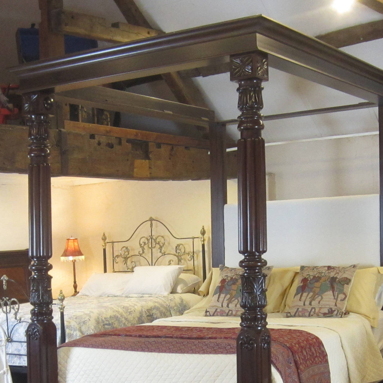 This mahogany four poster bed has superb mid-Nineteenth posts, circa 1860. The remainder of the framework has been reconstructed faithful to the original design.

The posts were sourced from Paris but possibly they originated from the French West