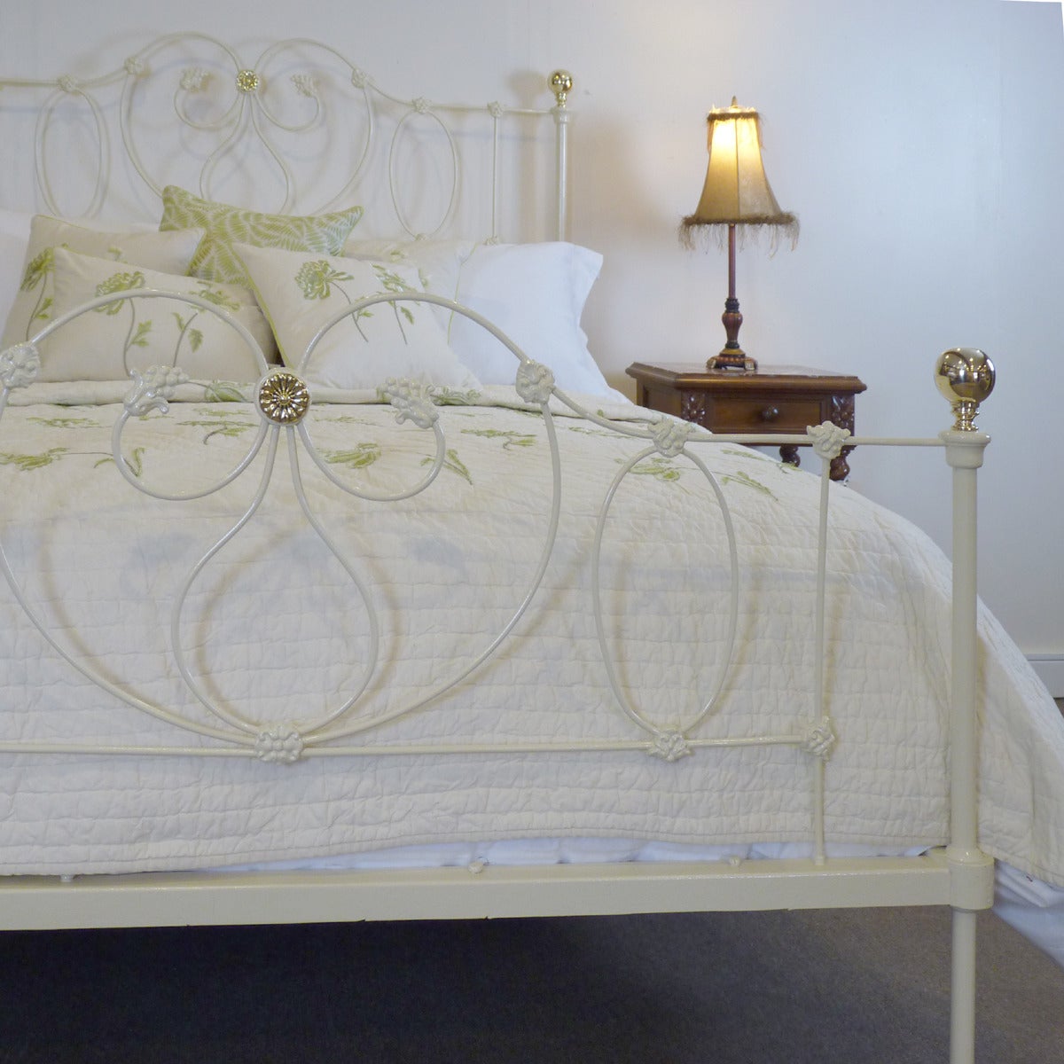 This fine example of an iron bedstead has been restored and widened from an original frame from the mid-Victorian era.

Finished in cream with brass knobs and central brass rosette, this bed can be repainted if required and the brass can be nickel