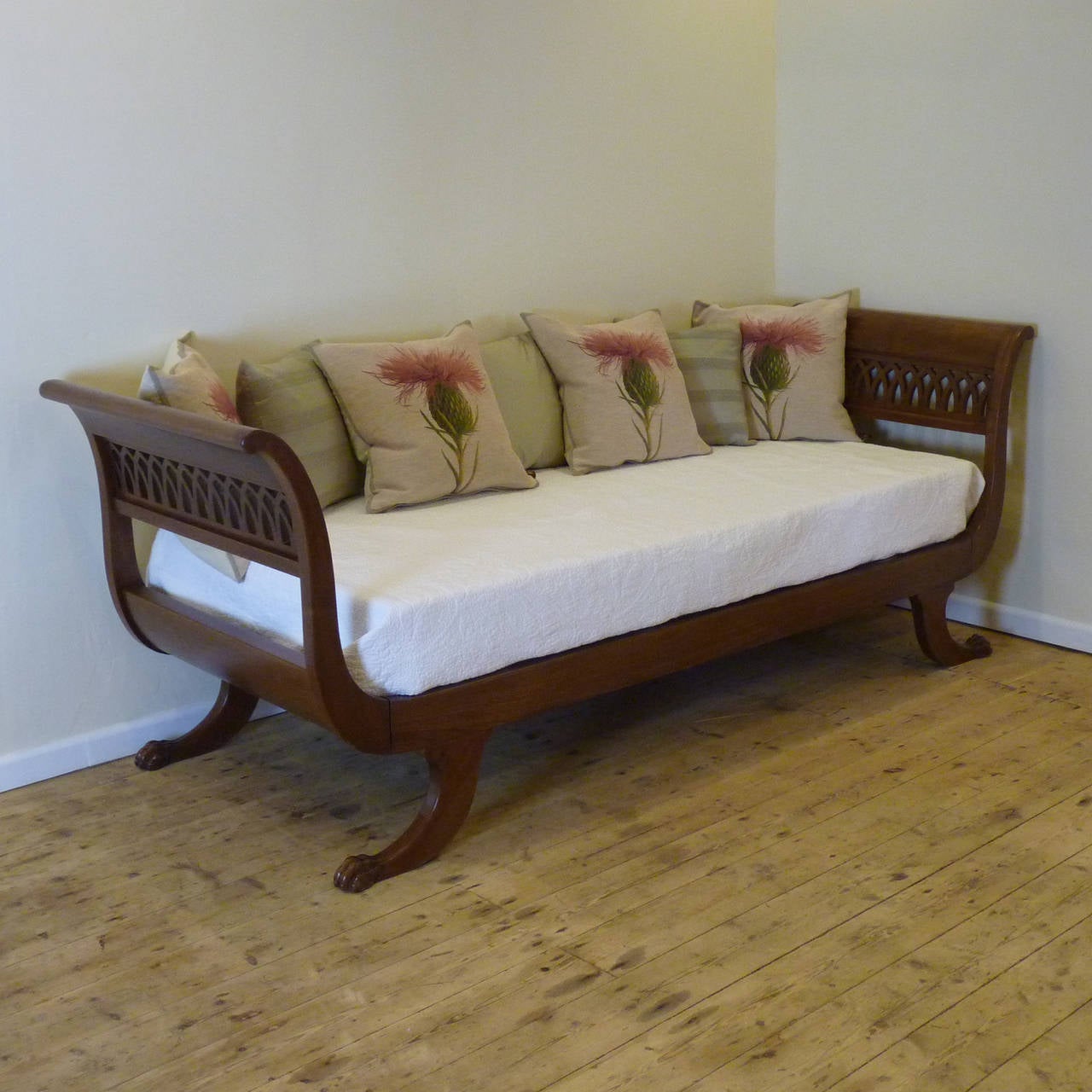 A superb example of a mahogany day bed from the mid-Twentieth Century with 