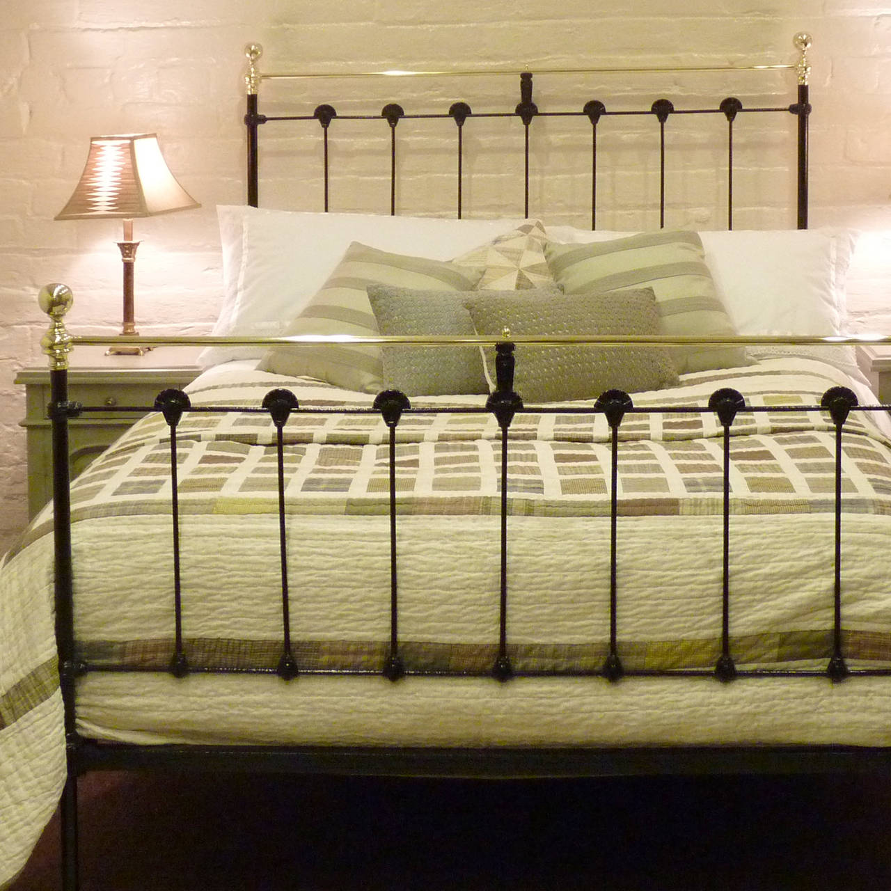 A Victorian cast iron and brass bed finished in stove enamelled black with straight brass top rail and knobs.

This bed will accept a double (4 ft 6 inches wide) bed base and mattress set, which can be purchased from Seventh Heaven.

All the