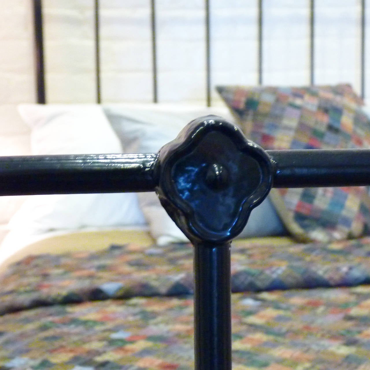 A  cast iron and brass bedstead finished in stove enamelled black with straight brass top rail and simple but attractive cast iron mouldings.
This bed accepts a 4ft 6inches wide double size base and mattress set.
The price is for the bedstead