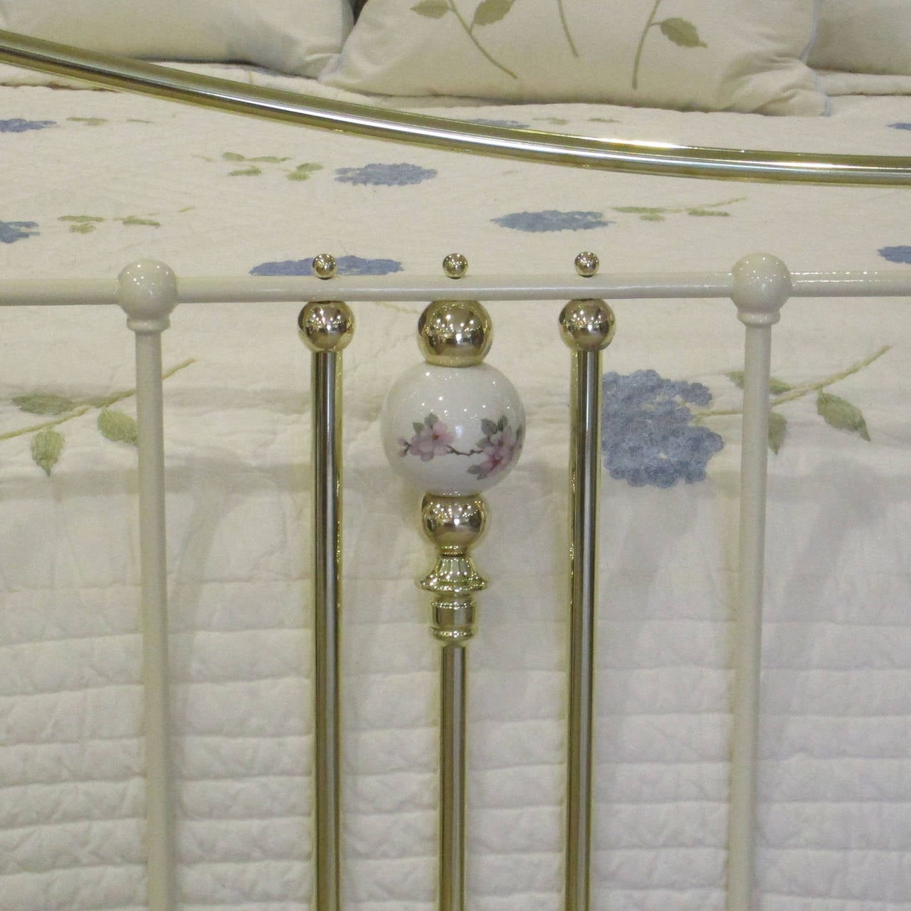 brass headboard with porcelain knobs