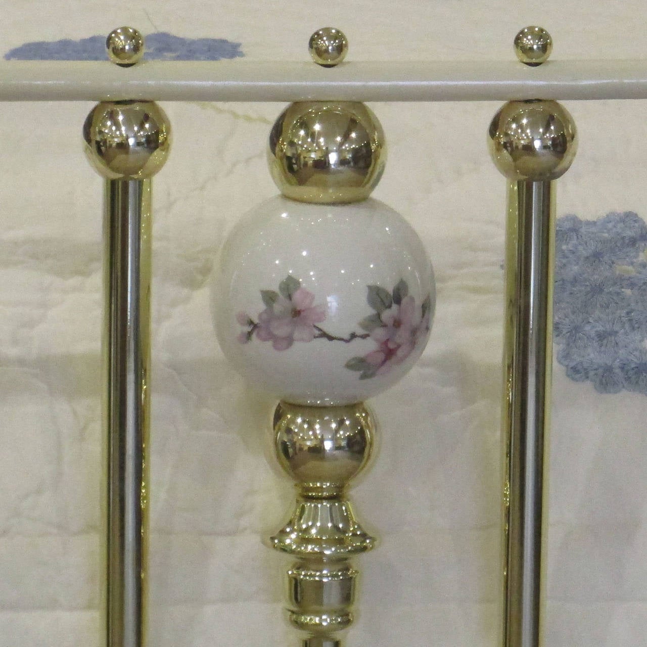 brass bed with porcelain balls