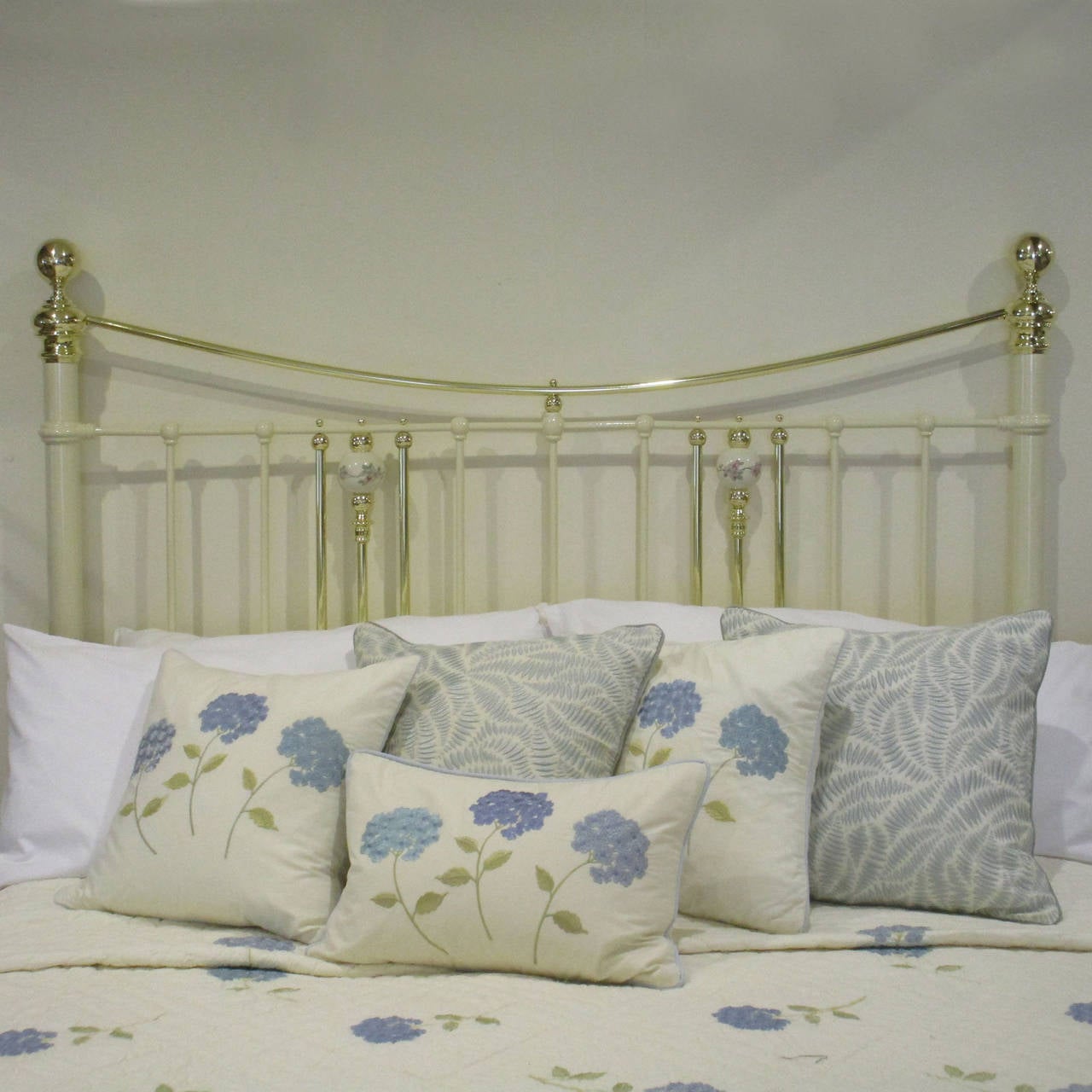 antique brass bed with porcelain