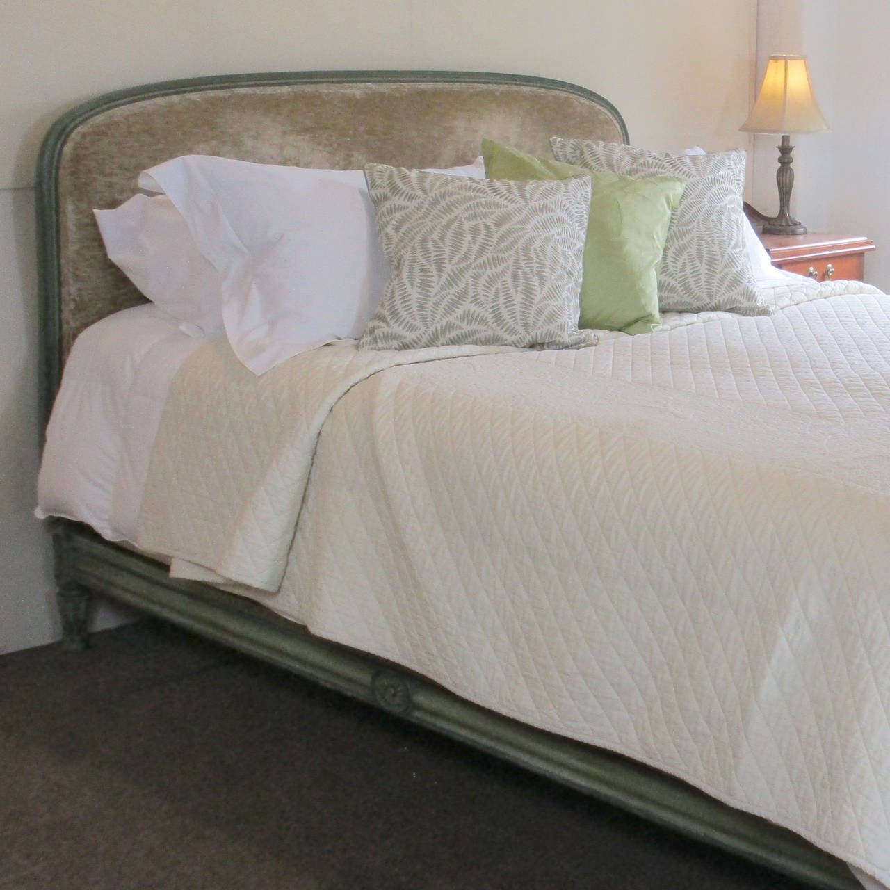 An upholstered bedstead with original painted framework on it’s original side runners. The panels upholstered with this velour style fabric. It can be reupholstered if required for additional cost.

The bed is shown with a 5 ft wide bed base and