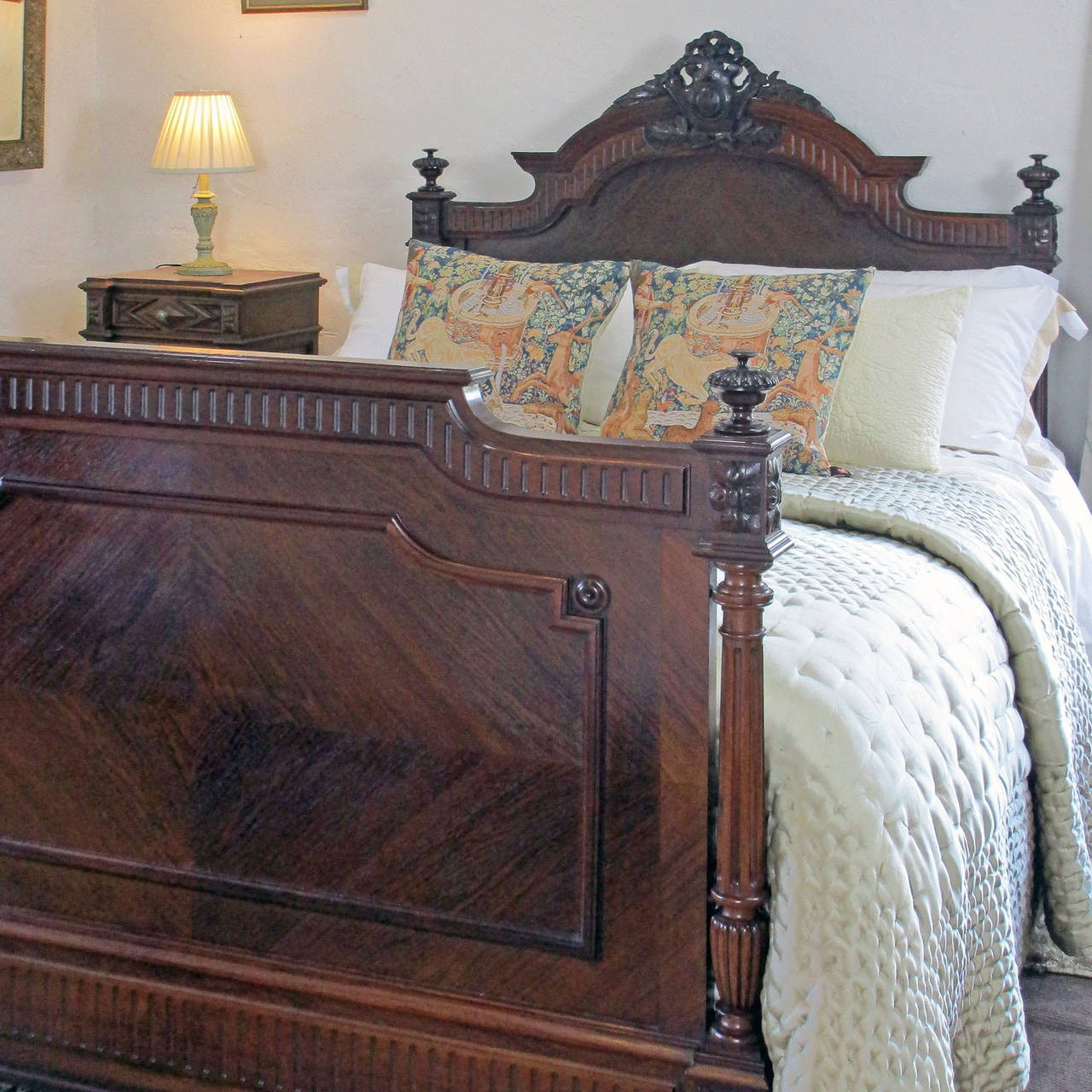 Mahogany Renaissance style bed with deep rich patina quarter panels and decorative posts. Circa 1900.
This bed accepts a 5ft wide bed base and mattress set.
The price is for the bedstead alone, the bed base, mattress and all of the bedding can be