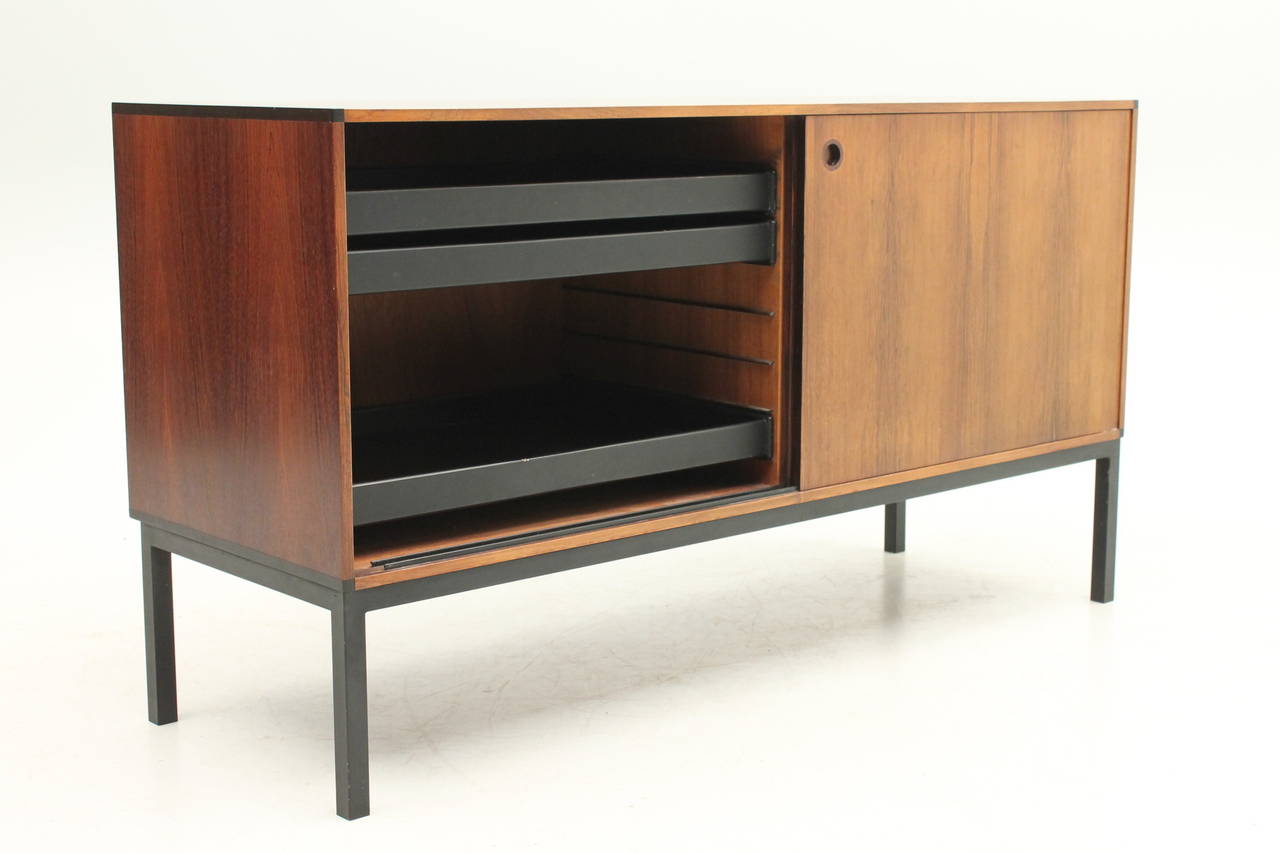 Beautiful rosewood credenza designed by Aksel Kjersgaard for Odder Furniture. The grain on this item is stunning. The inside of the item has several adjustable drawers perfect for papers and filing needs.