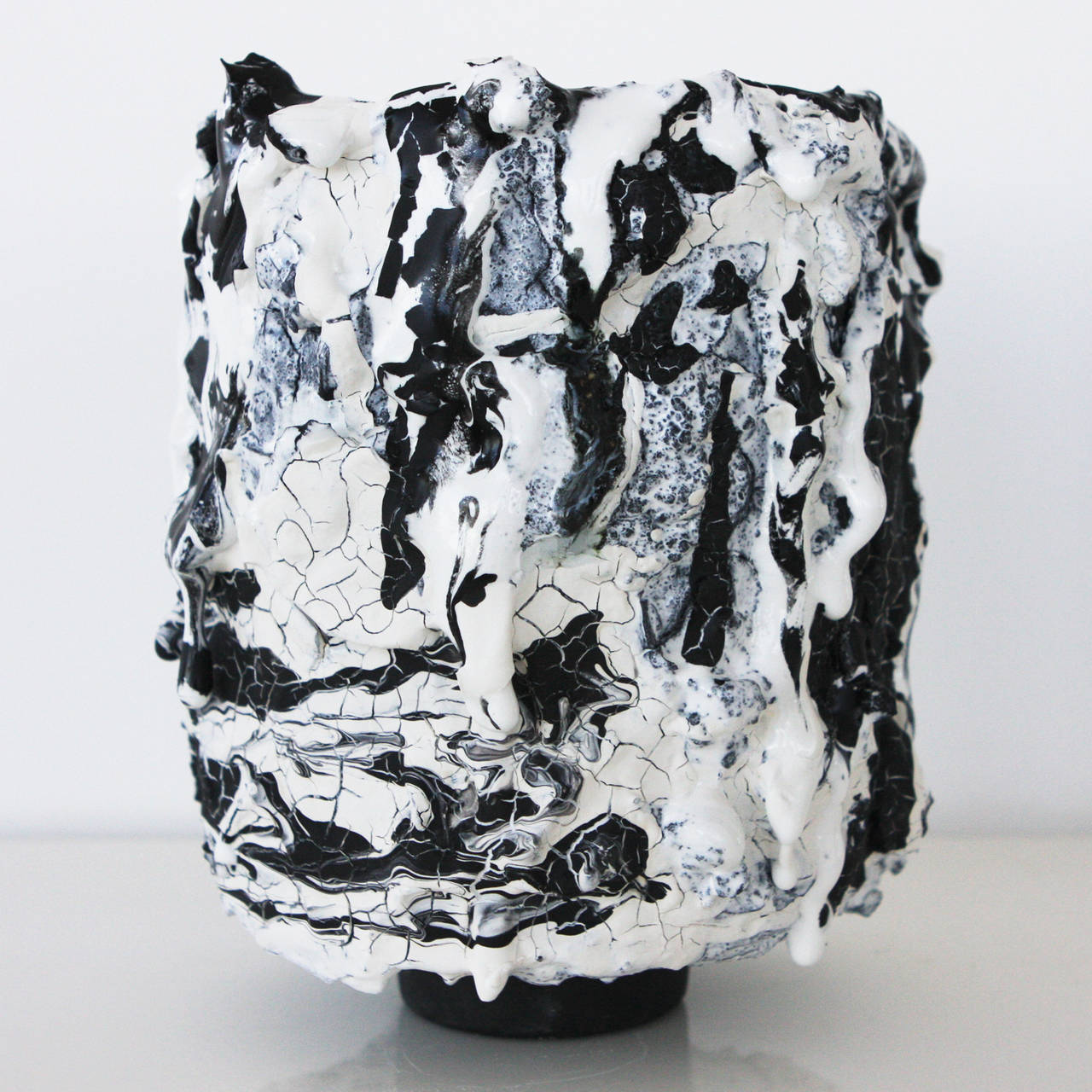 Contemporary ceramic vessel by LA based mixed-media sculptor Brian Rochefort for Kelly Behun Studio. Highly textured and worked surface resulting from multiple firings. Black and white glaze on exterior, black glaze interior. Watertight, may be used