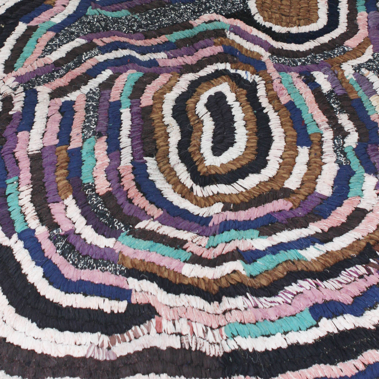 Contemporary Moroccan handwoven rug utilizing cotton remnants in a loop technique. Highly unique and original organic pattern, very painterly. Dominant colors are lavender, brown, cream, turquoise, pale pink and black.
